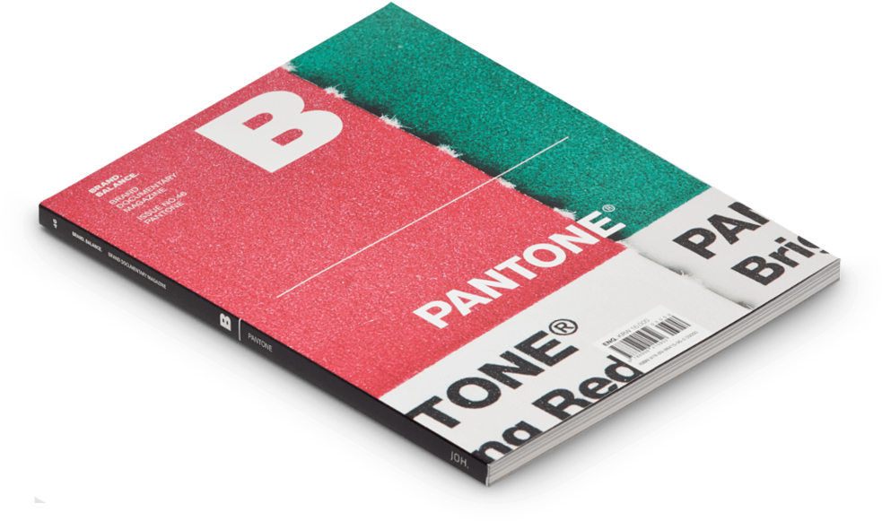 Pantone主題雜誌封面 壁紙 — 一本 Pantone 色票書，帶有鮮明的紅色、綠色和白色頁面，傾斜在黑色背景上。