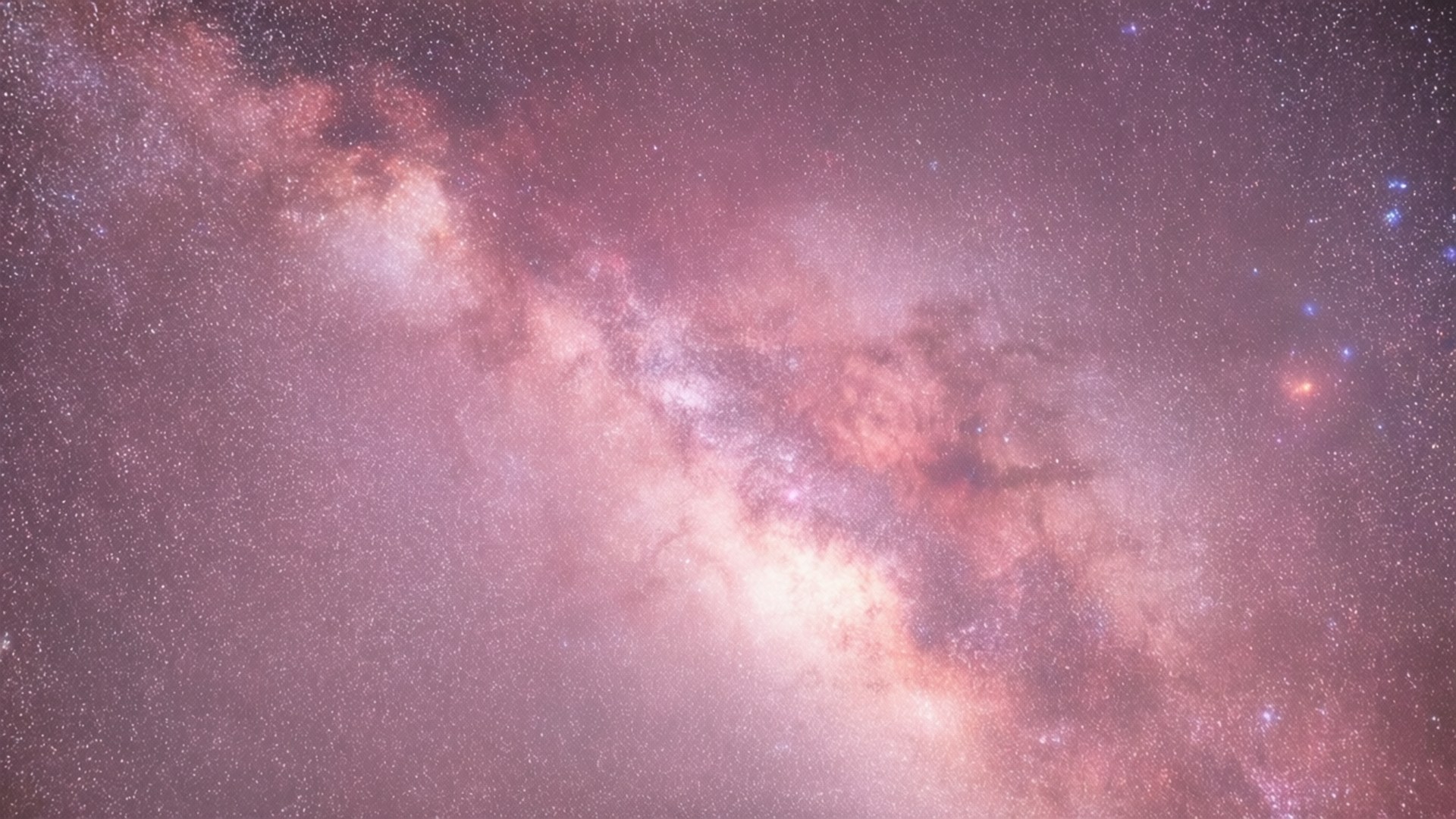 銀河系，帶有粉紅色和紫色的星雲，以及夜空中無數的星星