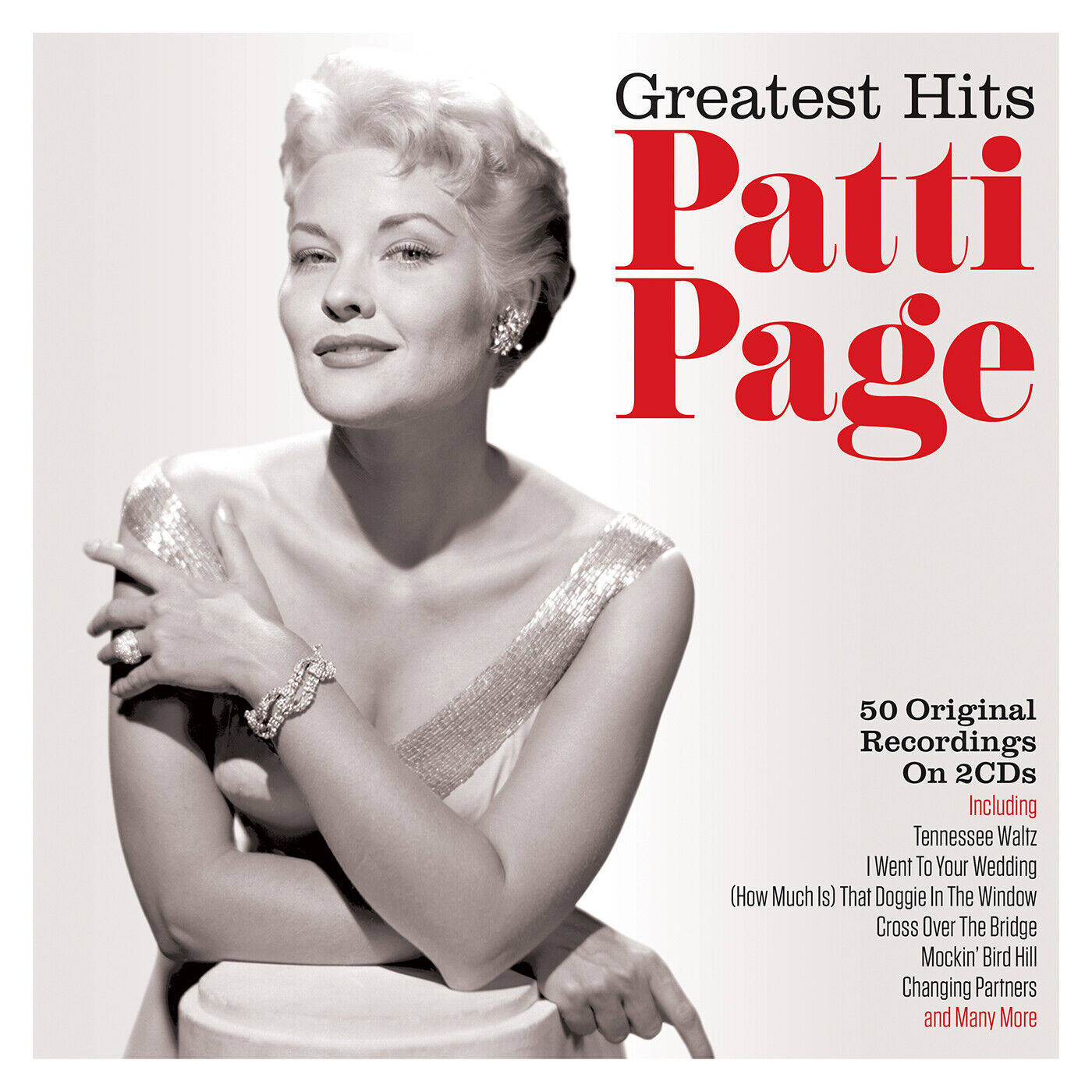 Patti Page 在她的 Greatest Hits 專輯封面上穿著華麗的銀色連衣裙。
