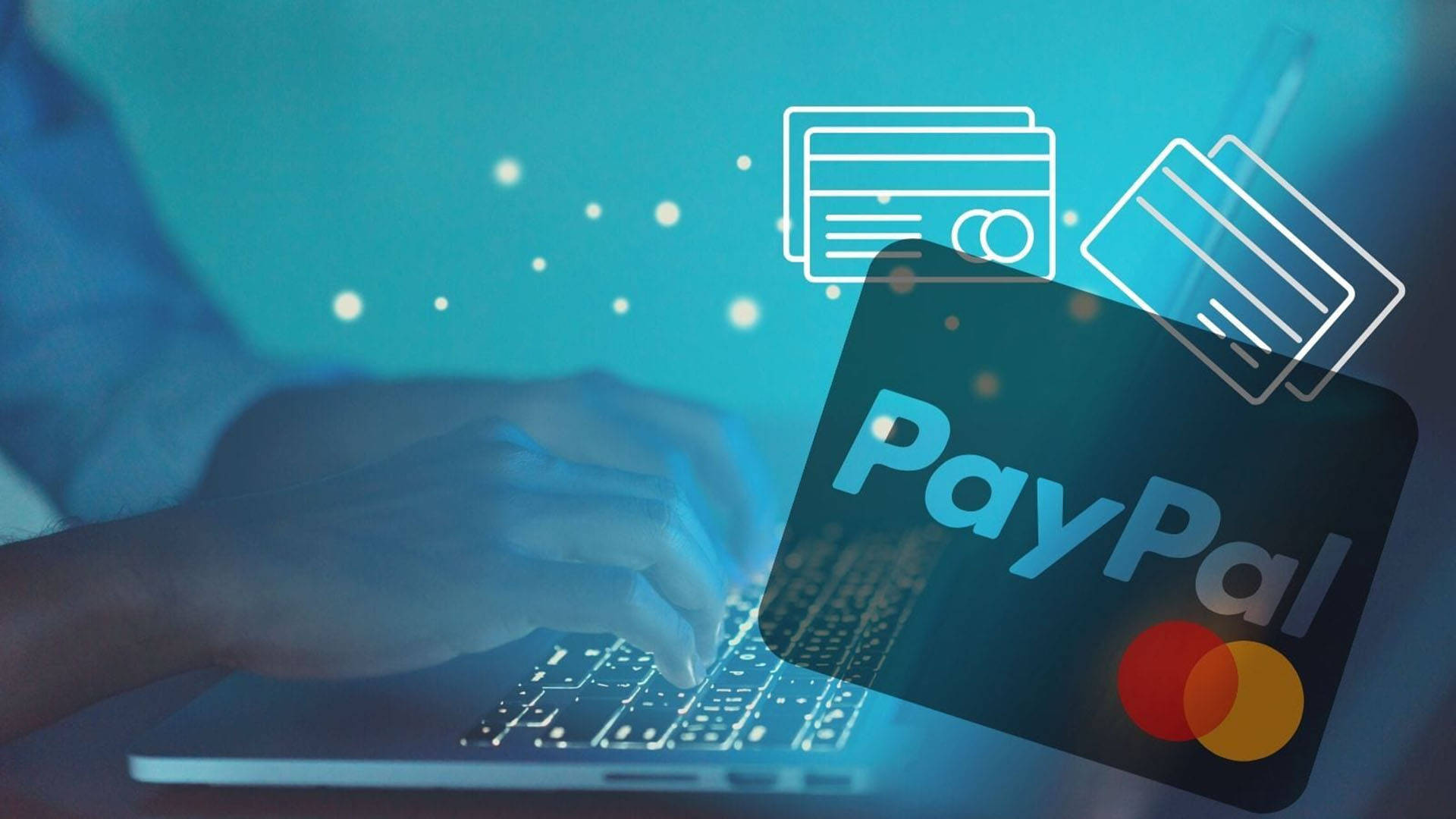 PayPal與Mastercard 壁紙 — 雙手在筆記型電腦上打字，發光的PayPal和信用卡圖示漂浮在冷藍色數位光芒中。