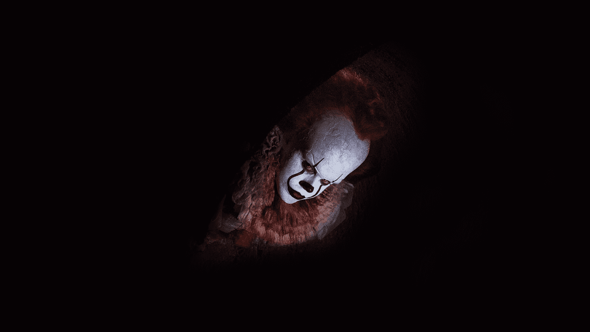 在黑暗中出現的 Pennywise 小丑 壁紙