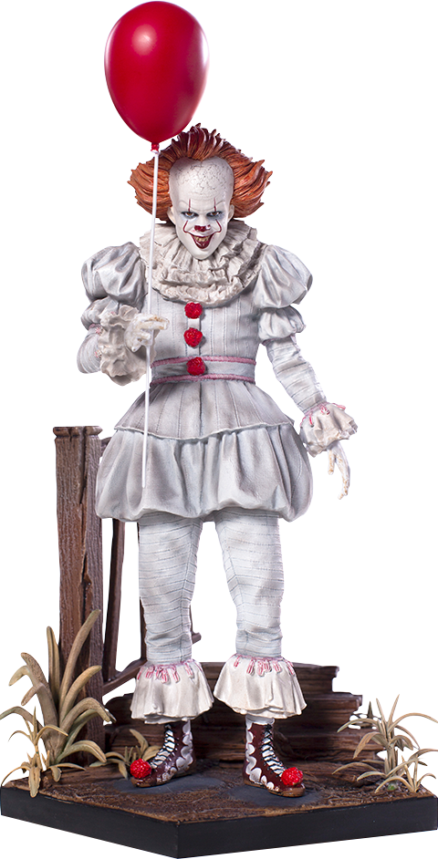 手持紅氣球的 Pennywise 雕像 壁紙 — 一個帶有紅髮和紅色氣球的威脅小丑站在一個被乾燥植物包圍的木製平台上。