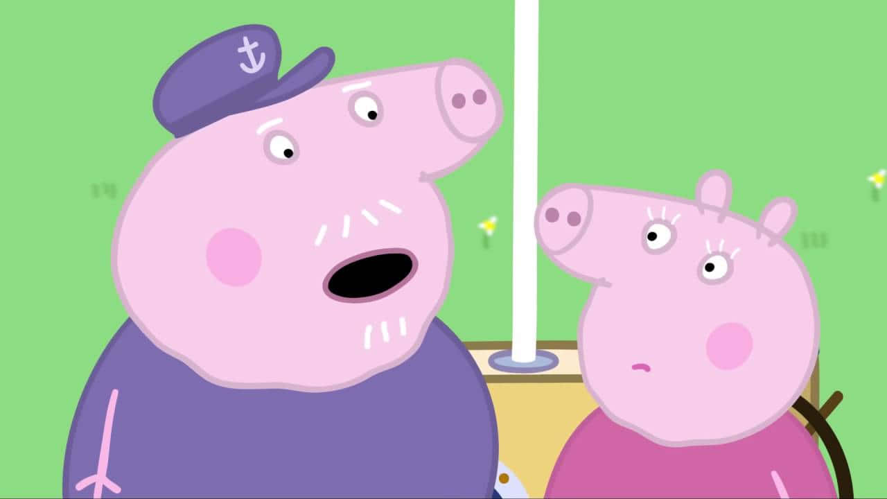 Grandpa Pig 桌布 壁紙 — Peppa Pig 和她的父親穿著水手服，在綠色背景和白色柱子的襯托下顯得驚訝。