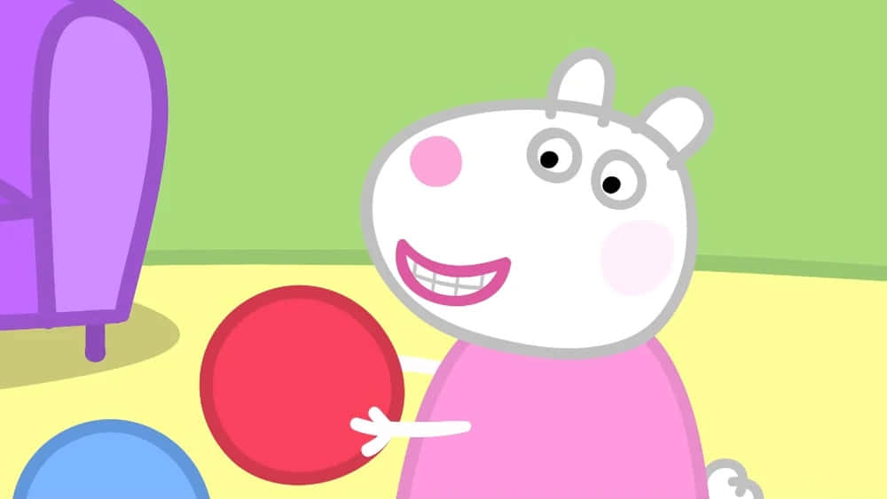 Suzy Sheep 桌布 壁紙 — Peppa Pig 喺色彩繽紛嘅卡通房入面，開心咁攞住一個紅色波。