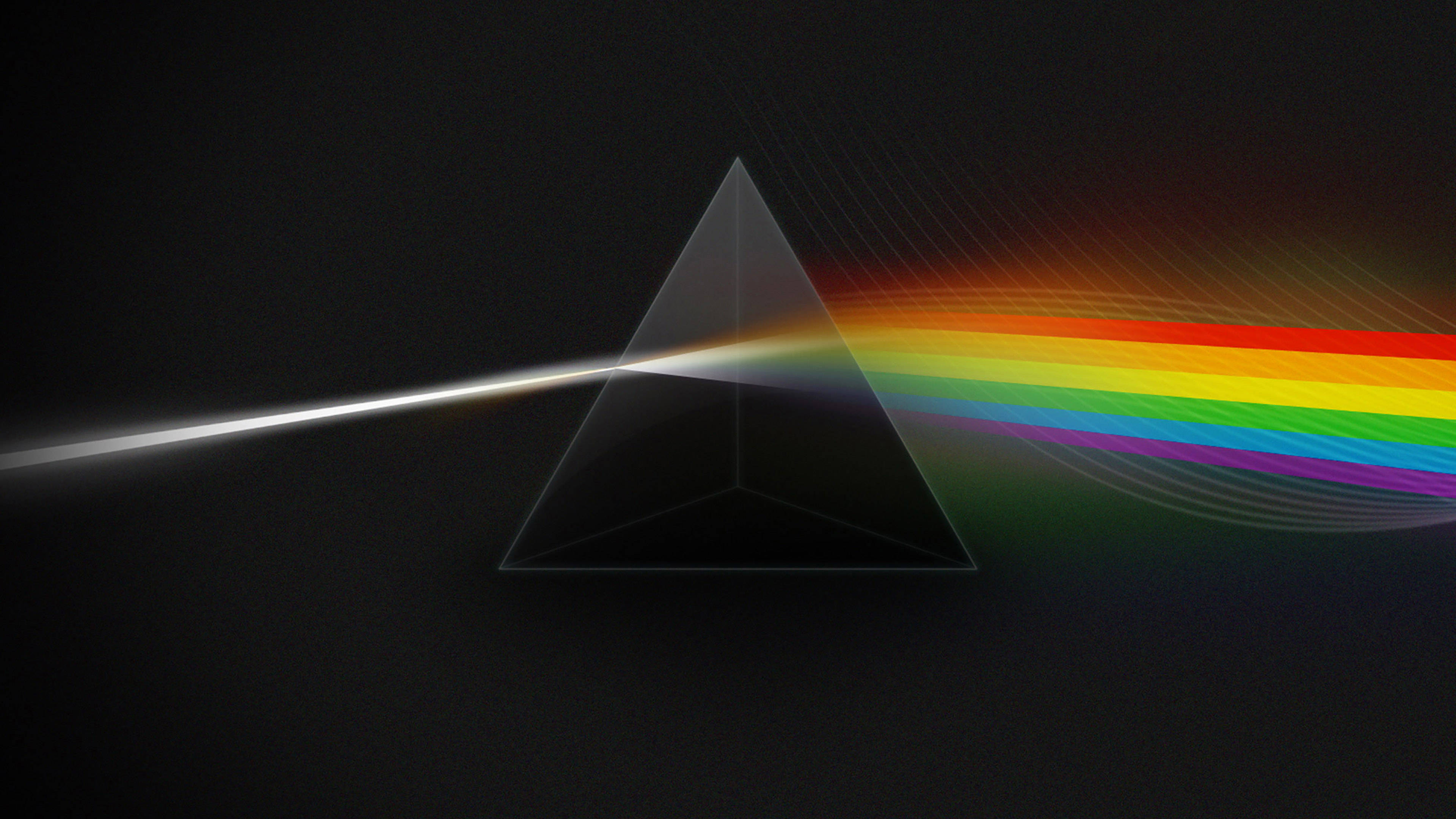 Pink Floyd 4K 月之暗面 壁紙 — 玻璃棱鏡將一束白光折射成在深色背景上鮮豔的彩虹光譜。