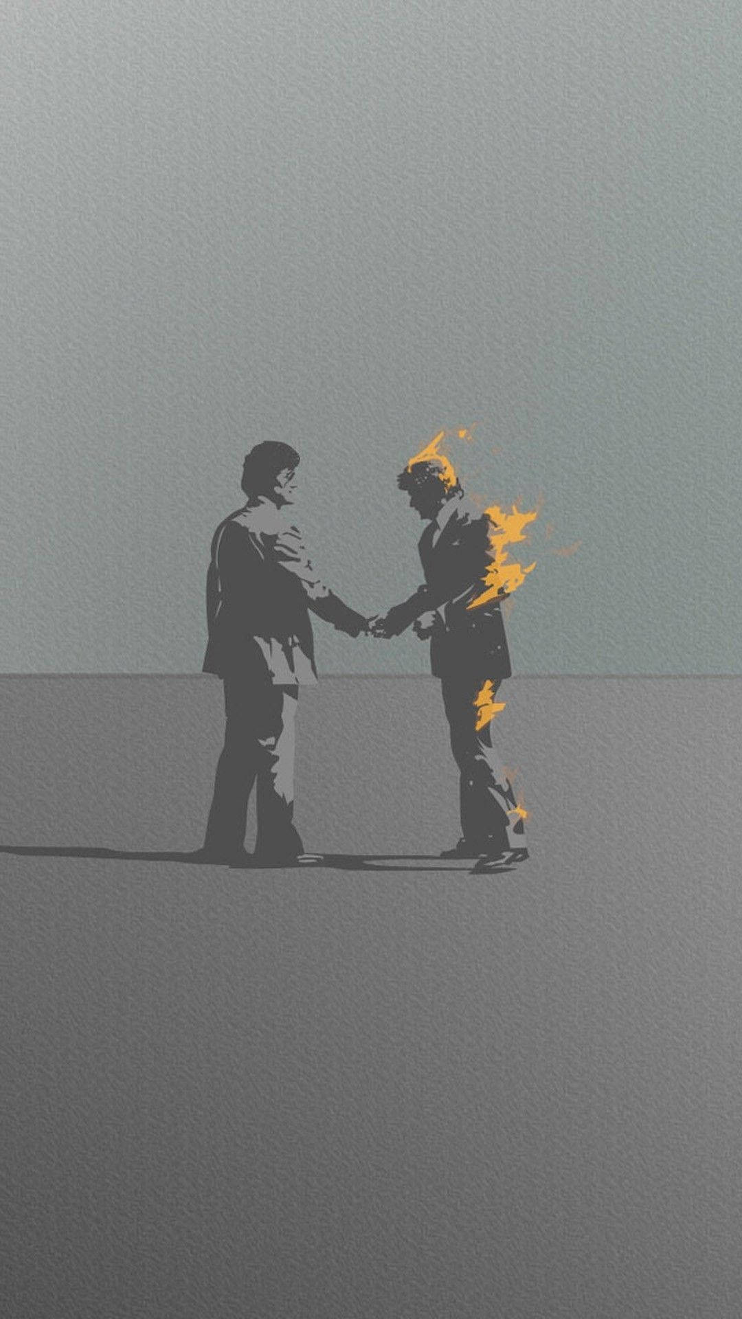 兩個商人握手，其中一個著火
