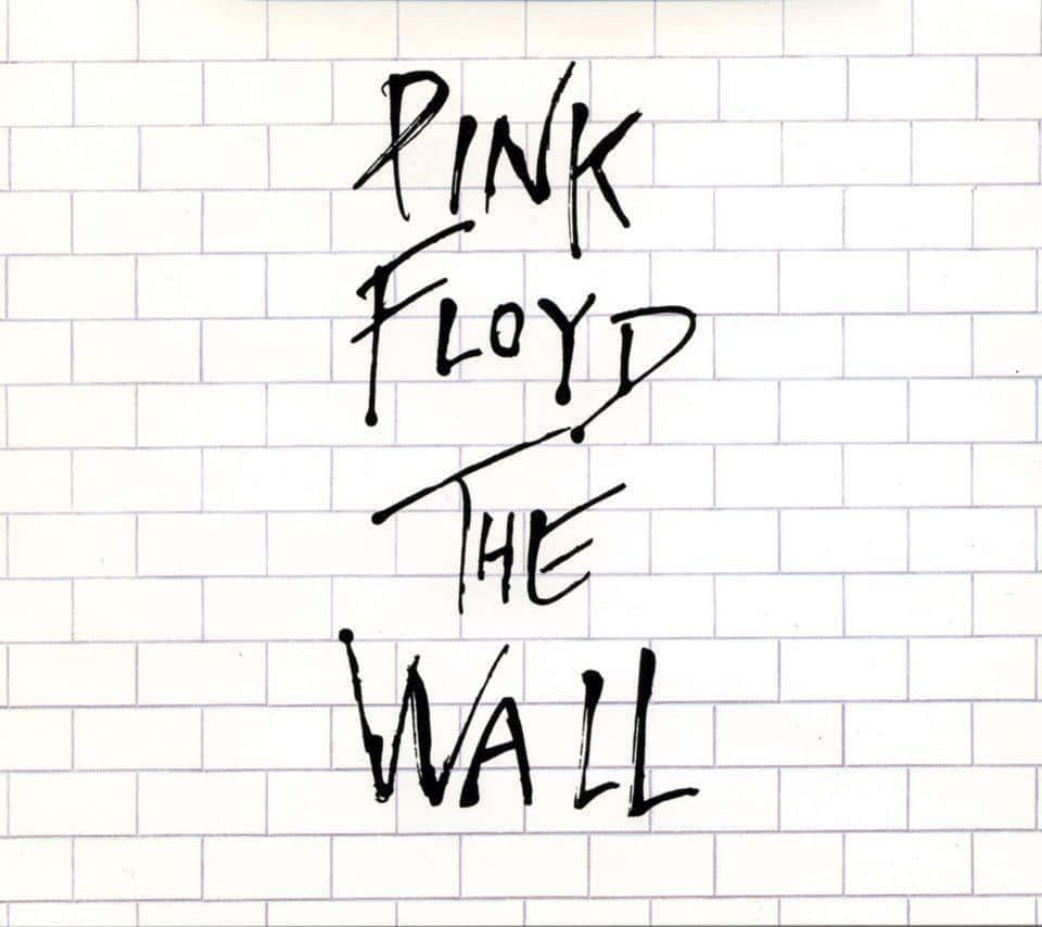 Pink Floyd The Wall 專輯封面，白色瓷磚上有手寫文字。