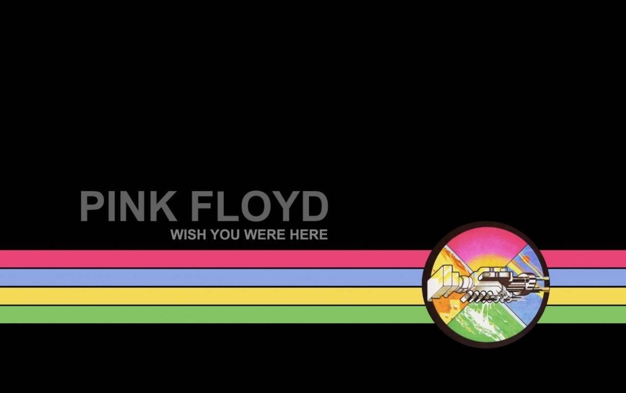 Pink Floyd《Wish You Were Here》專輯海報 壁紙 — Pink Floyd 專輯封面，帶有彩虹條紋和飛越地球的太空船，背景為黑色。