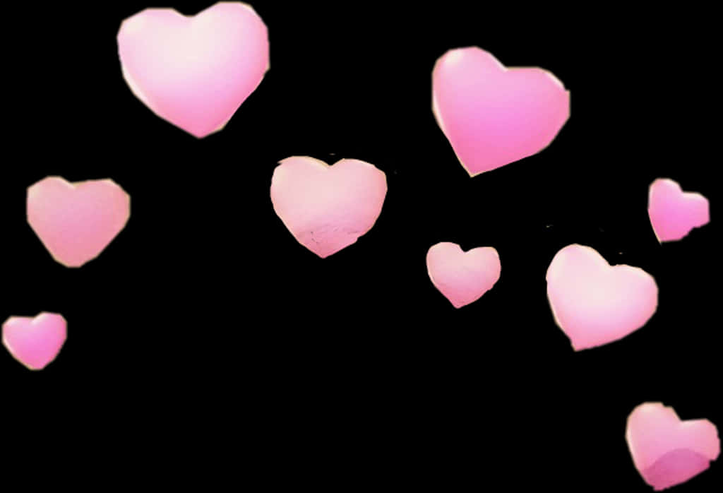 Pink Hearts Against Black Background 壁紙 — 柔軟發光的粉紅色心形在深黑色背景上輕輕漂浮，營造出夢幻浪漫的氛圍。