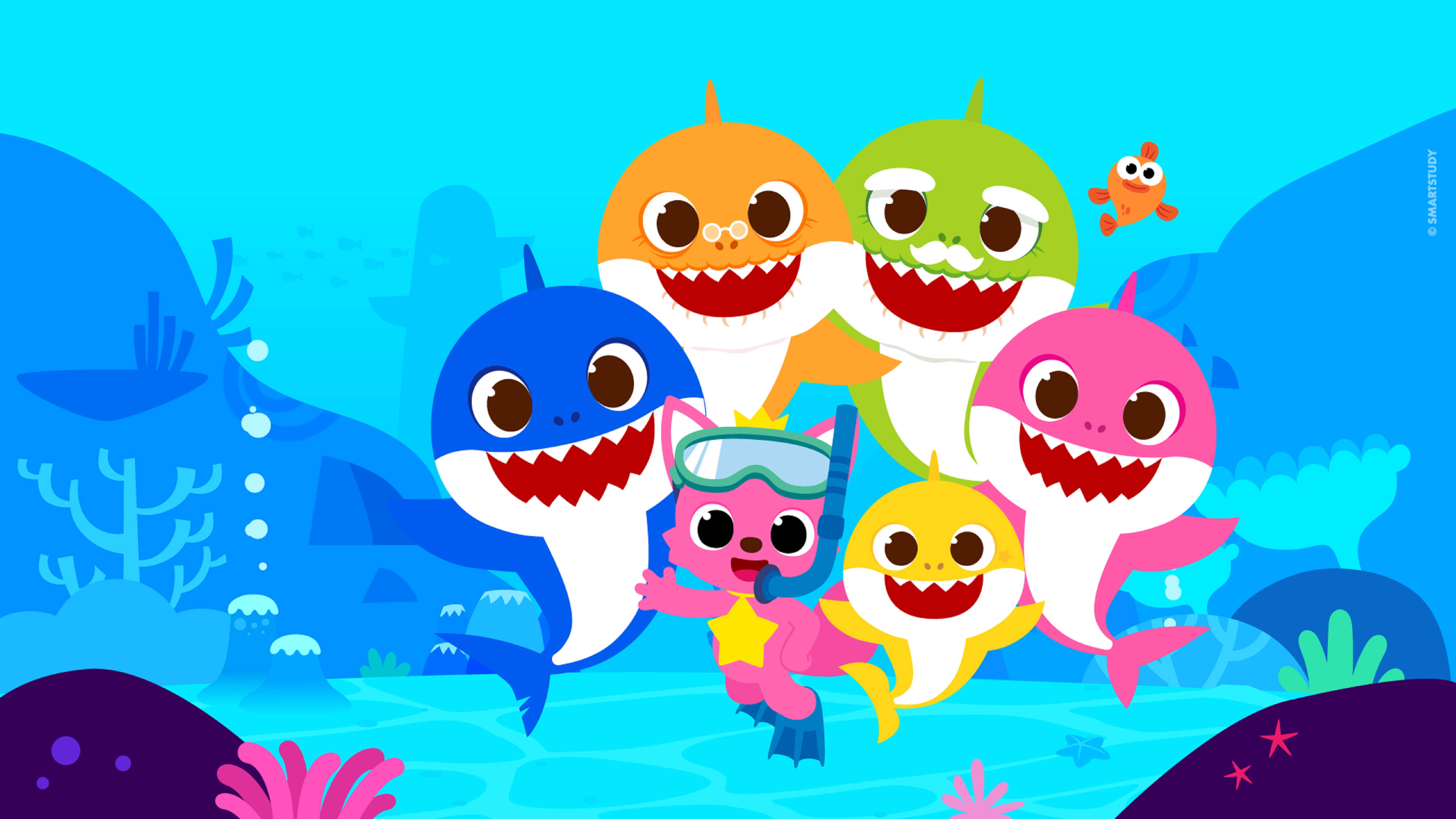 Pinkfong與Baby Shark家族 壁紙 — 色彩繽紛的卡通鯊魚和潛水員以俏皮的表情探索充滿活力的海底珊瑚礁。
