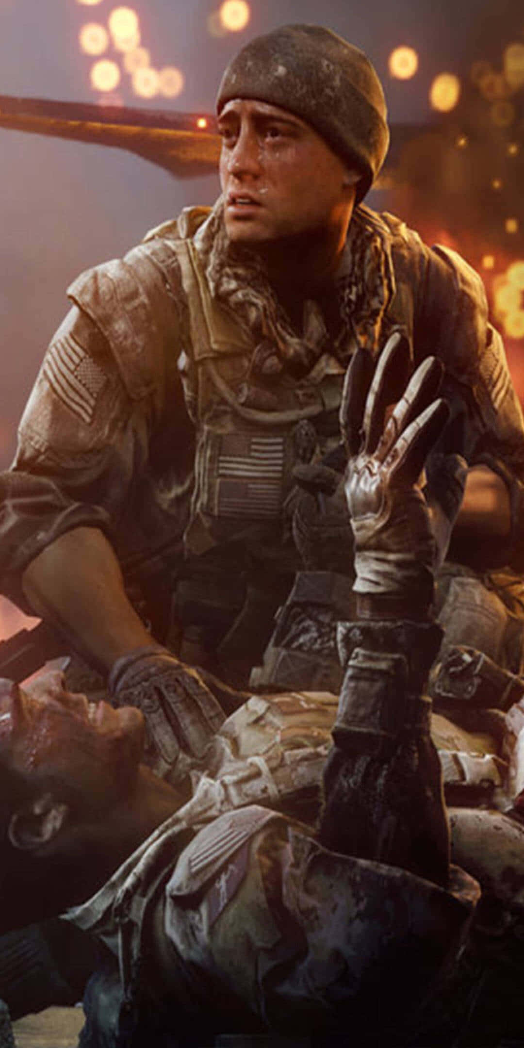 Pixel 3 Battlefield 4 背景：比利·布里傑 壁紙 — 一名身穿迷彩裝備的士兵跪在倒下的戰友身旁，背景是熾熱的戰場和發光的散景燈光。