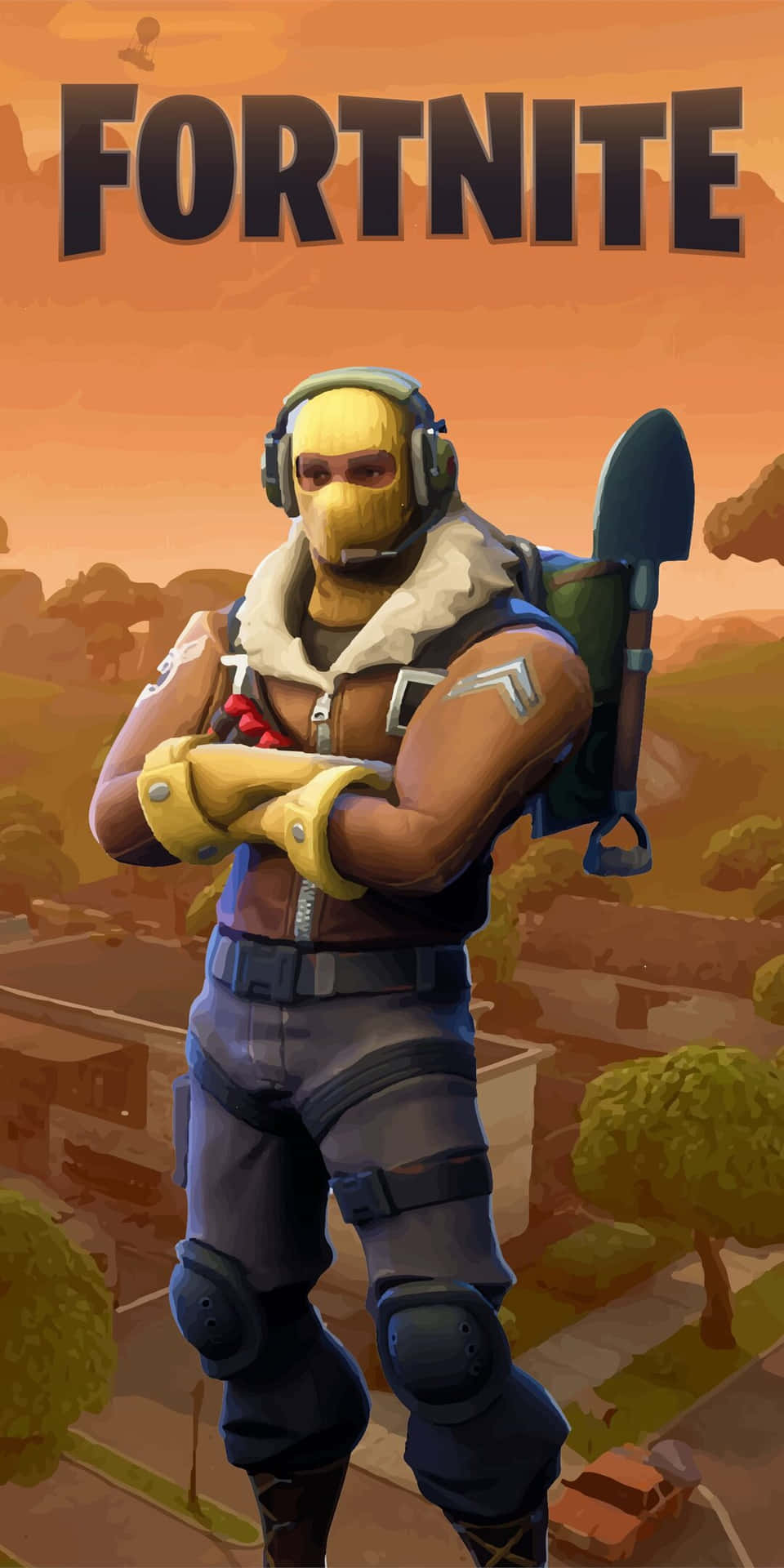 穿著黃色面具和裝備的Fortnite角色自信地交叉雙臂站立。
