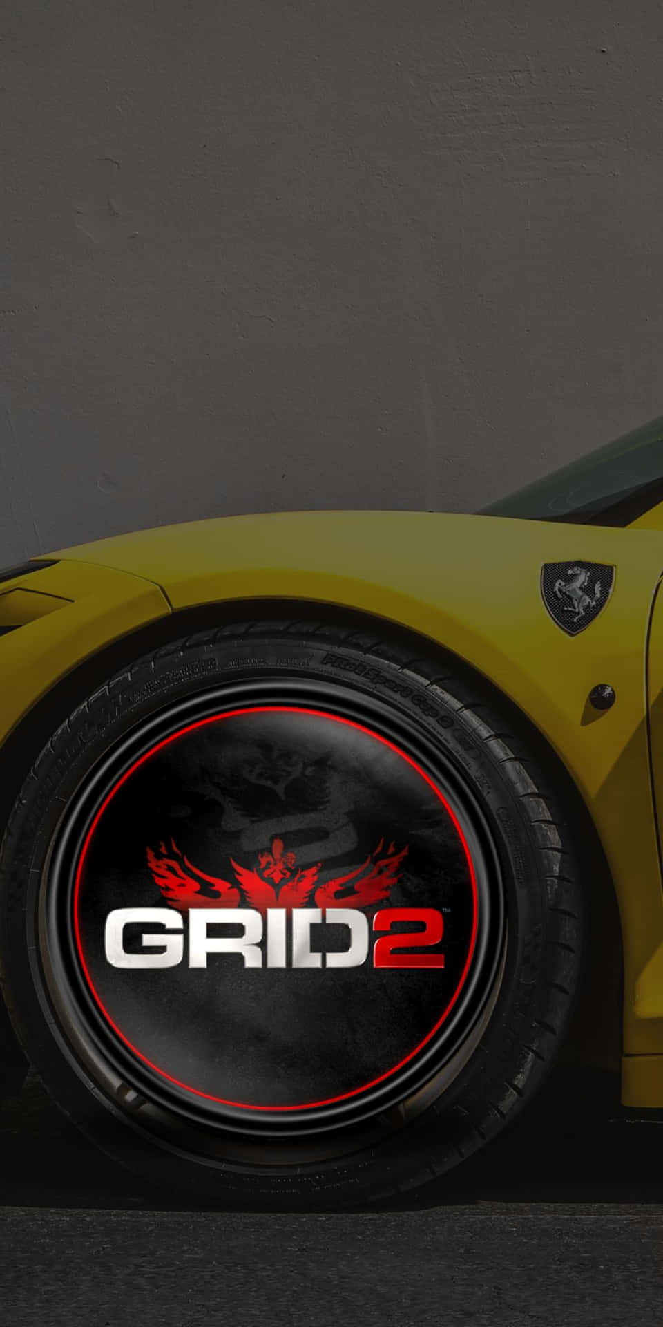 黃色法拉利車輪，帶有GRID 2遊戲標誌和紅色火焰設計。