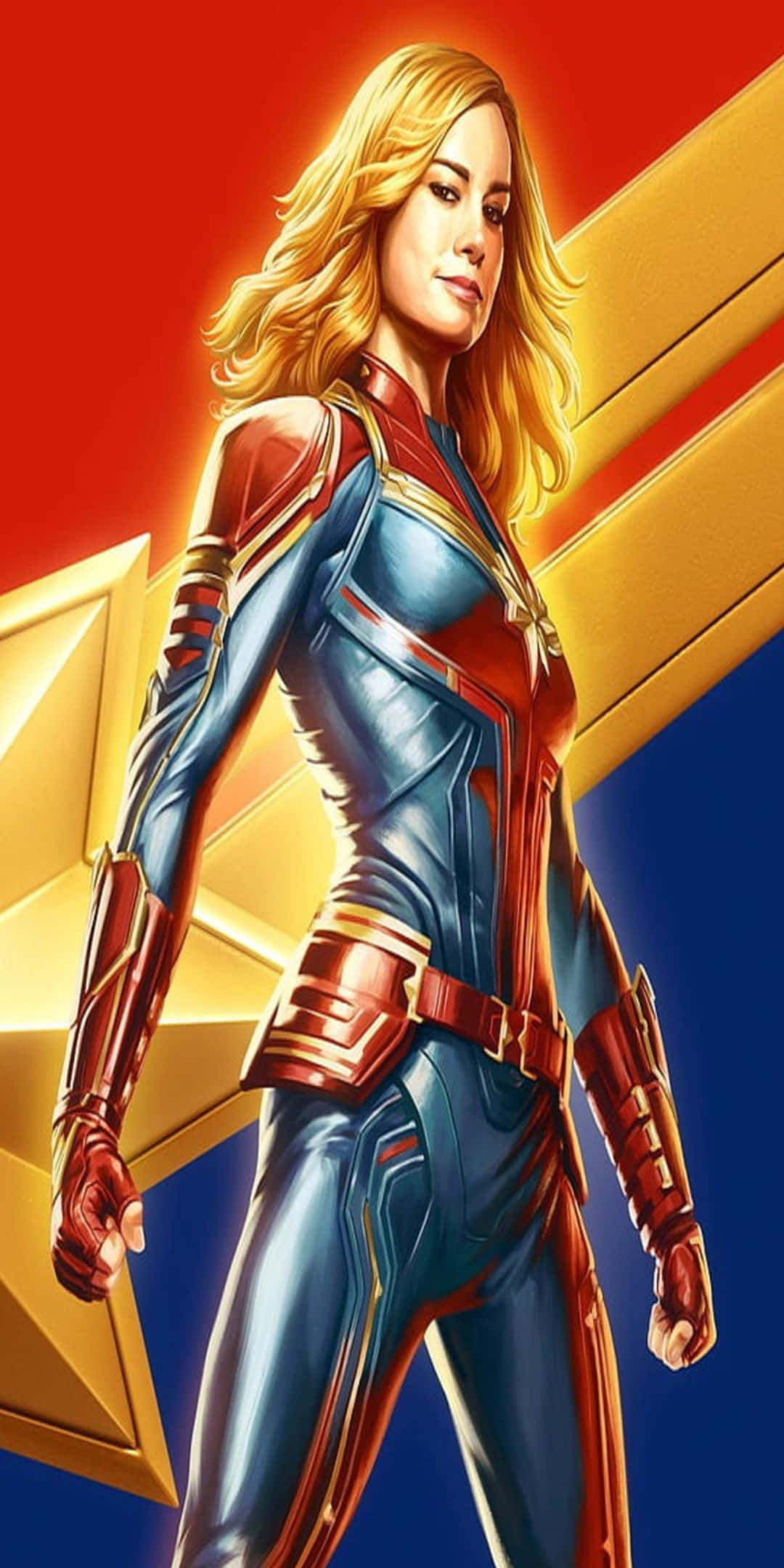 Pixel 3 卡普坦·馬克爾粉絲藝術背景 壁紙 — Captain Marvel 自信地穿著她的藍色和紅色套裝，站在大膽的紅色和金色星星背景前。