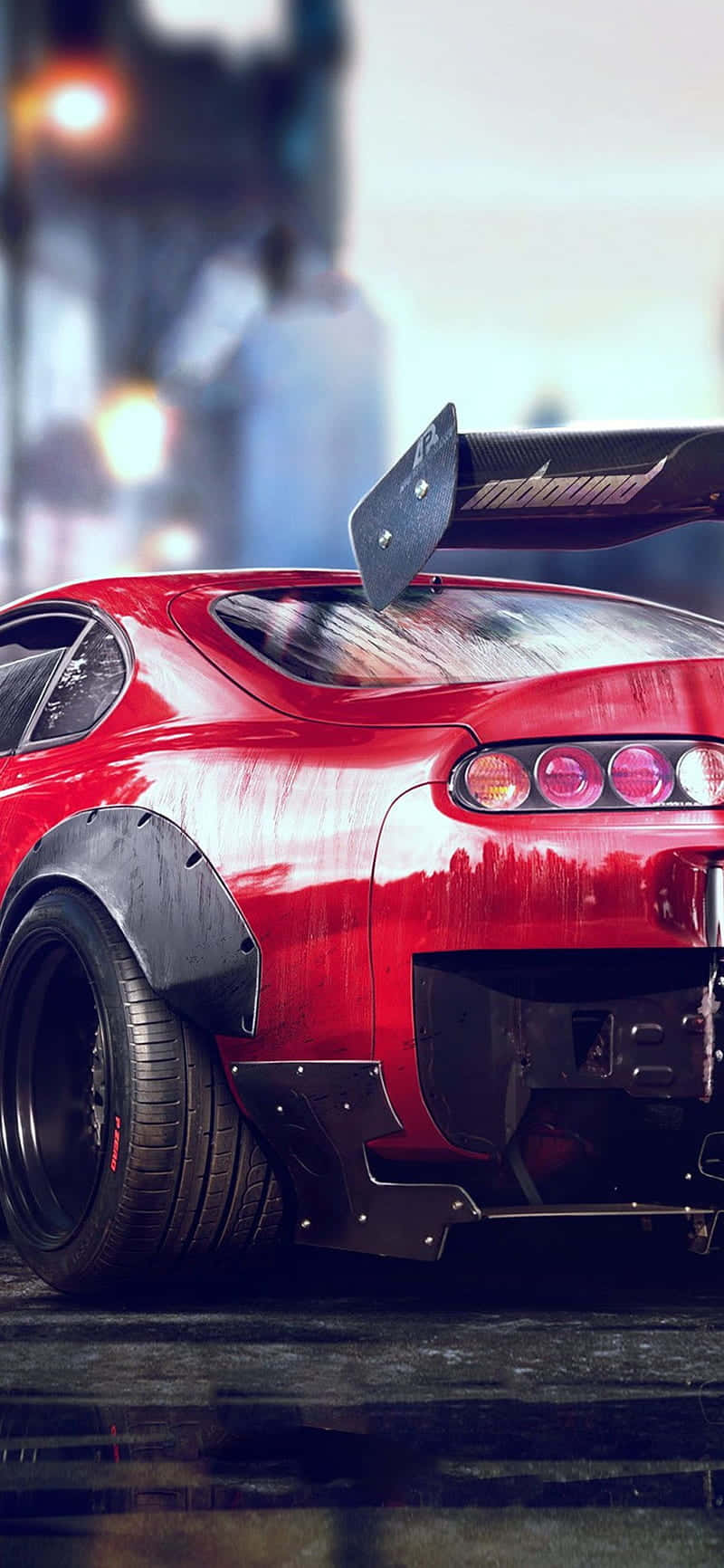 Pixel 3《Need for Speed》遊戲視覺震撼呈現 壁紙 — 一架光澤的紅色跑車，帶有大型後翼和黑色飾件，在黃昏時停泊在潮濕的城市街道上。