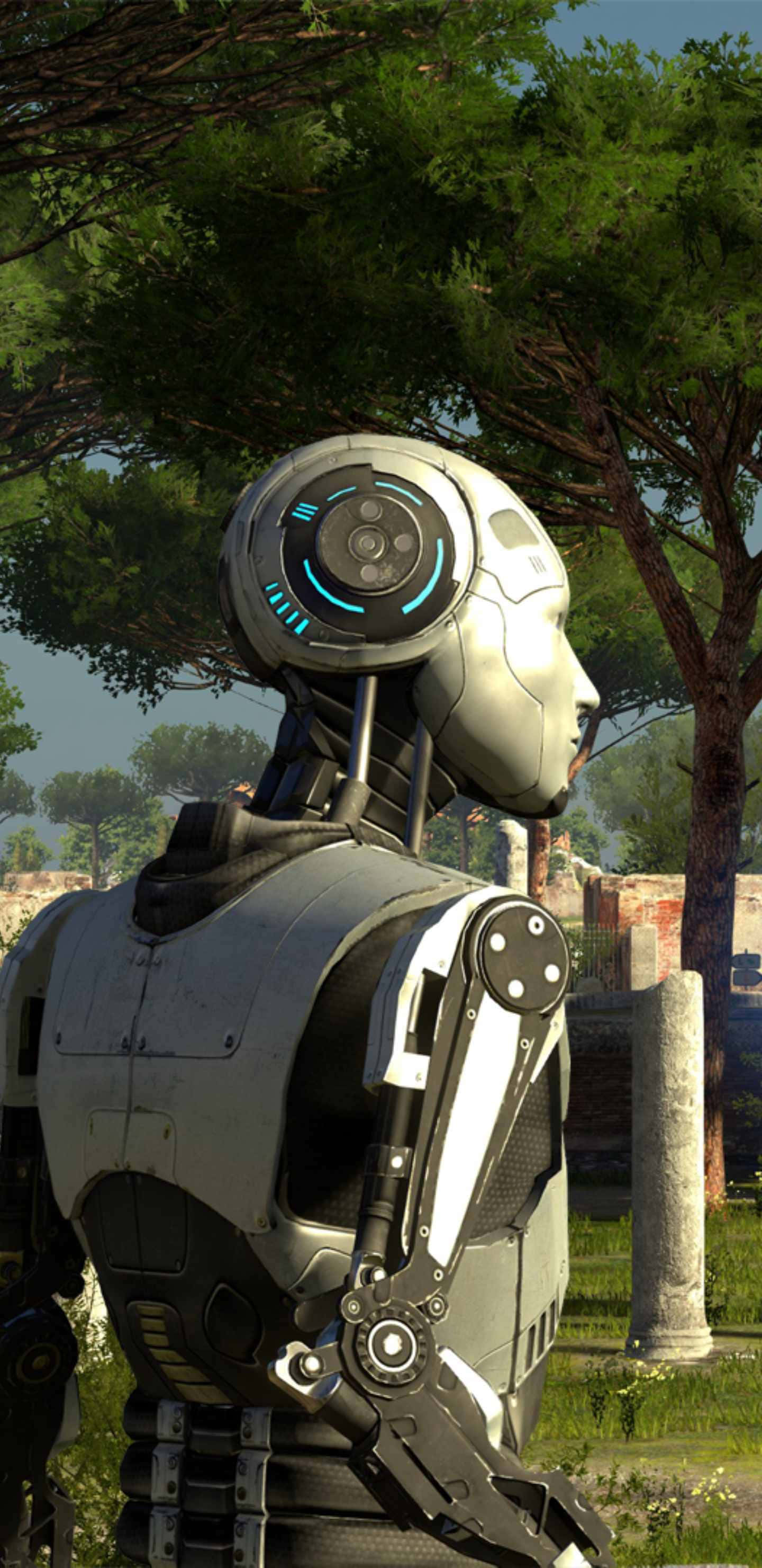 Pixel 3XL《The Talos Principle》背景：Uriel 戶外探險 壁紙 — 一個時尚的銀色機械人，帶有發光的藍色點綴，在明亮的日光下，站在茂密的綠樹和古老的石頭廢墟中，呈現側面輪廓。