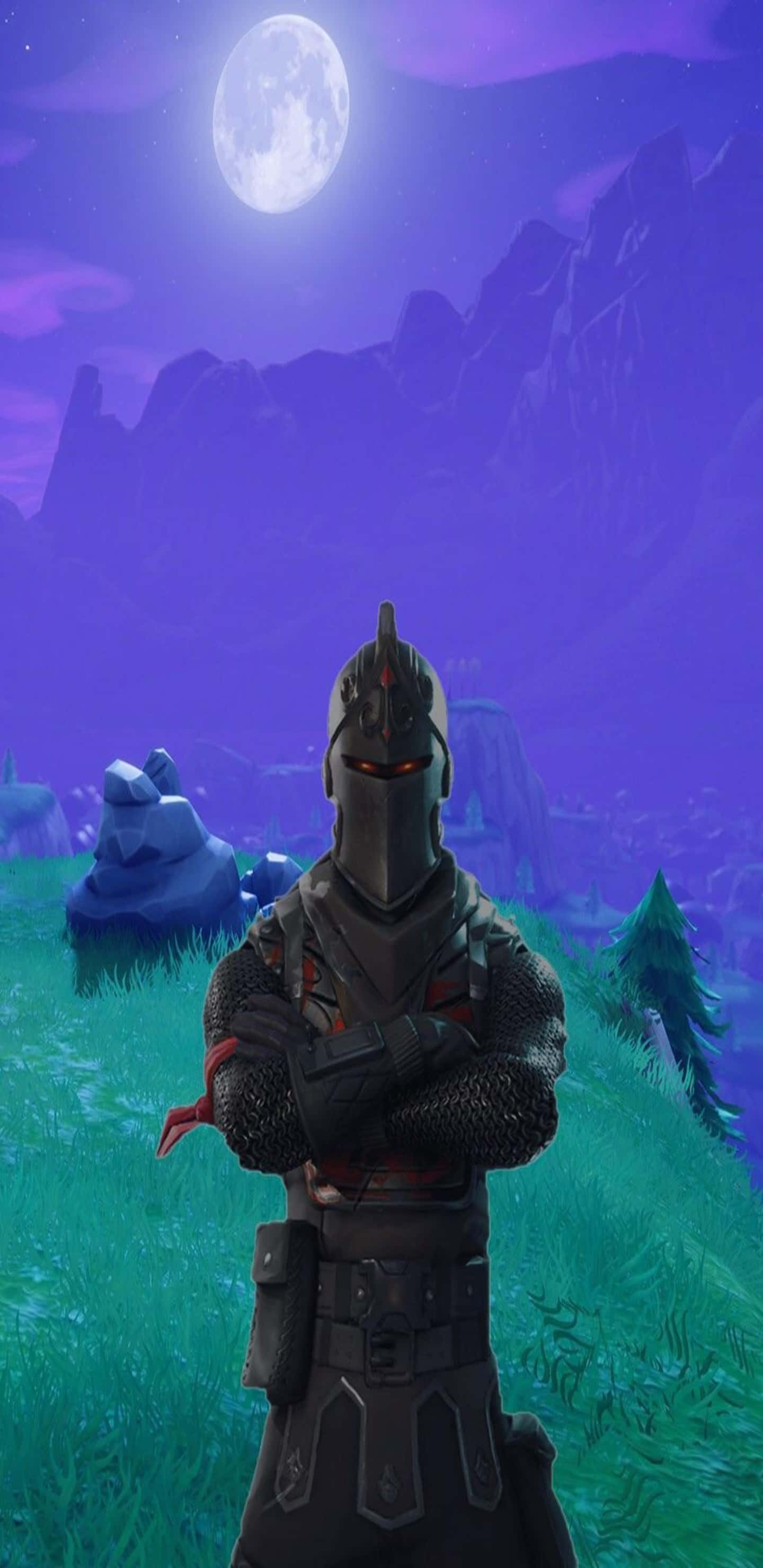 Pixel 3XL 王者騎士 Fortnite 競技場背景 壁紙 — 一名身穿暗色盔甲的騎士，在紫色山脈背景下，於發光的滿月下，雙臂交叉站在長滿青草的山丘上。