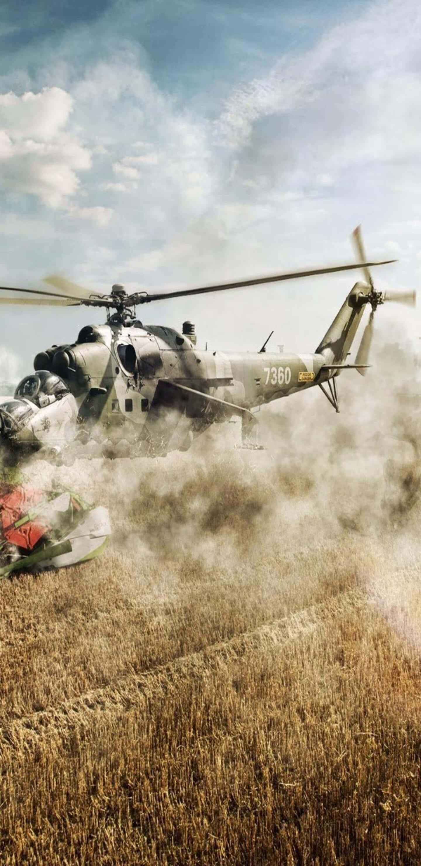 Pixel 3XL 背景：降落中的 Mil Mi-24 直昇機 壁紙 — 一架軍用直升機在多雲的天空下降落於乾燥的金色田野，揚起灰塵。
