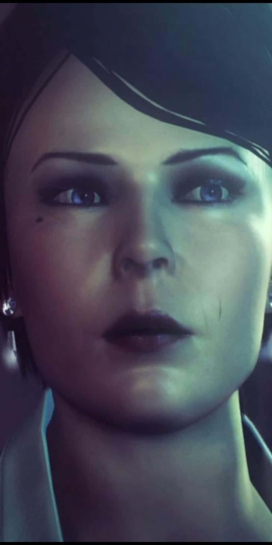 Pixel 3搭配《殺手：赦免》！ 壁紙 — 一個女人臉部的特寫，短黑髮，在冷藍色燈光下有一雙強烈的藍眼睛。