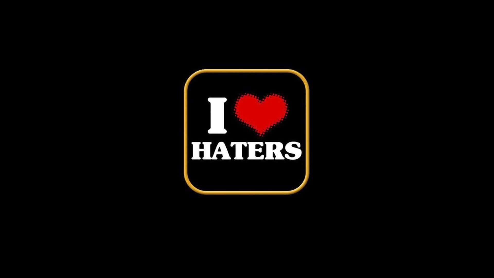  壁紙 — 一個像素化的紅色心形和粗體白色文字「I HATERS」在黑色背景上的金色邊框正方形內。