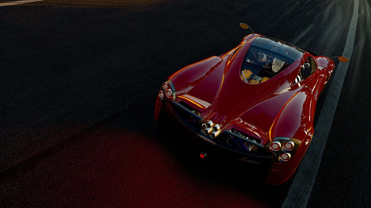 Project Cars 暗色賽道 720p 壁紙 — 一輛光澤的紅色超跑在戲劇性的低角度燈光下行駛在黑暗的瀝青賽道上。
