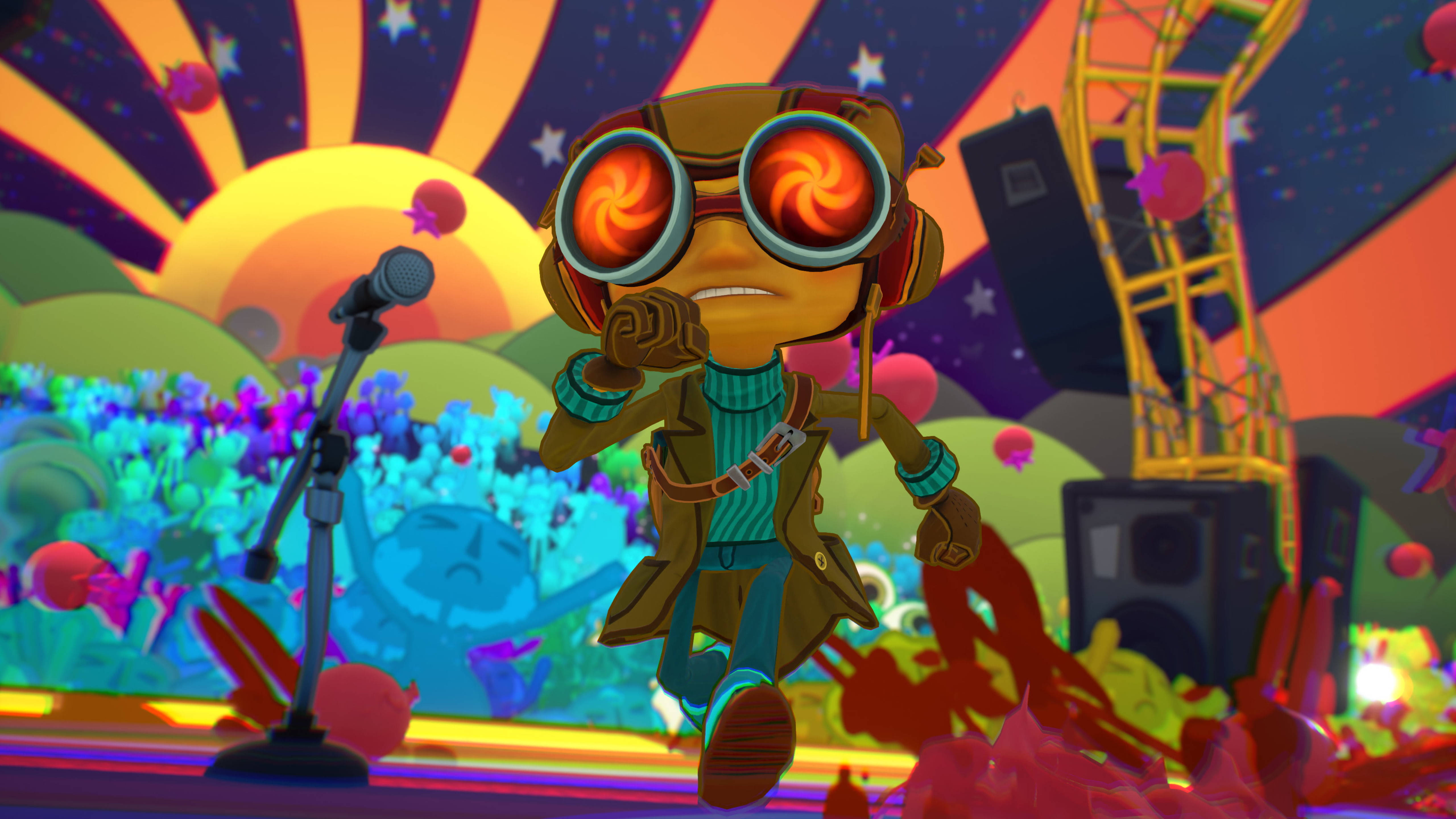Psychonauts 2 Xbox 遊戲畫面 壁紙 — 一個戴著發光漩渦護目鏡的卡通角色在充滿迷幻色彩的舞台上表演，背景是 vibrant 的日落天空。