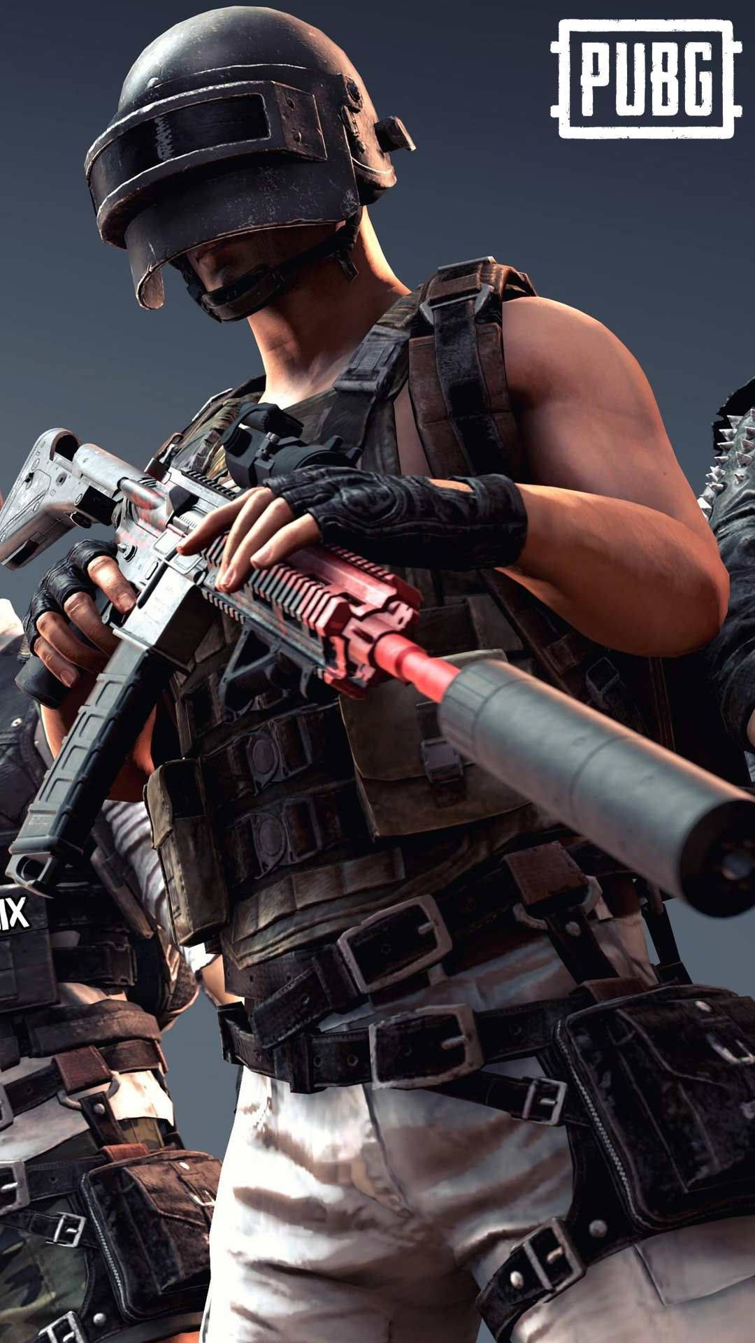 一名全副武裝的PUBG士兵手持一把槍口發出紅光的步槍。