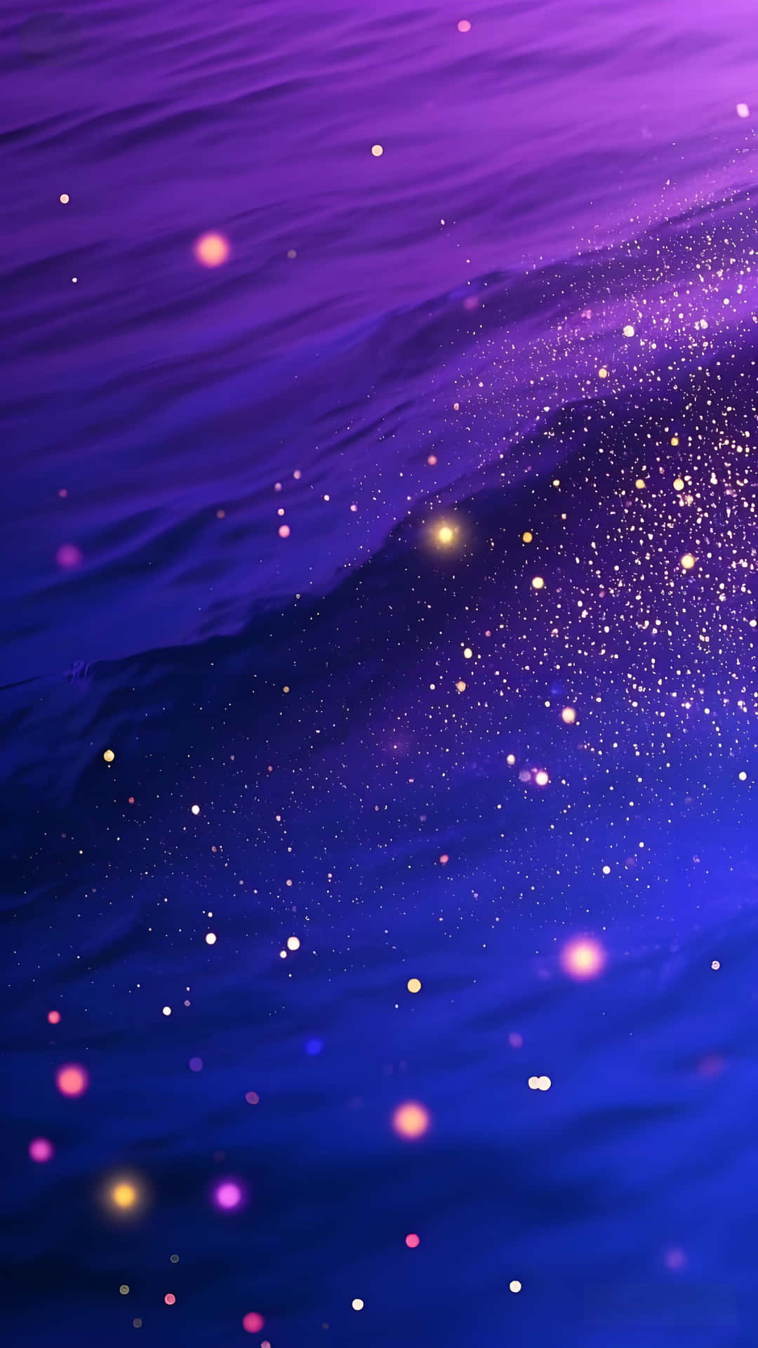 紫色和藍色水波閃爍著散落的星狀光芒