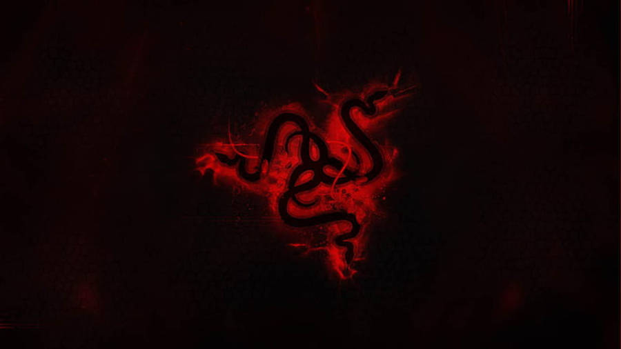 Razer 紅色霓虹標誌 4K 壁紙 — 一個發光的紅色Razer標誌像熔岩一樣在深色紋理背景上浮現。