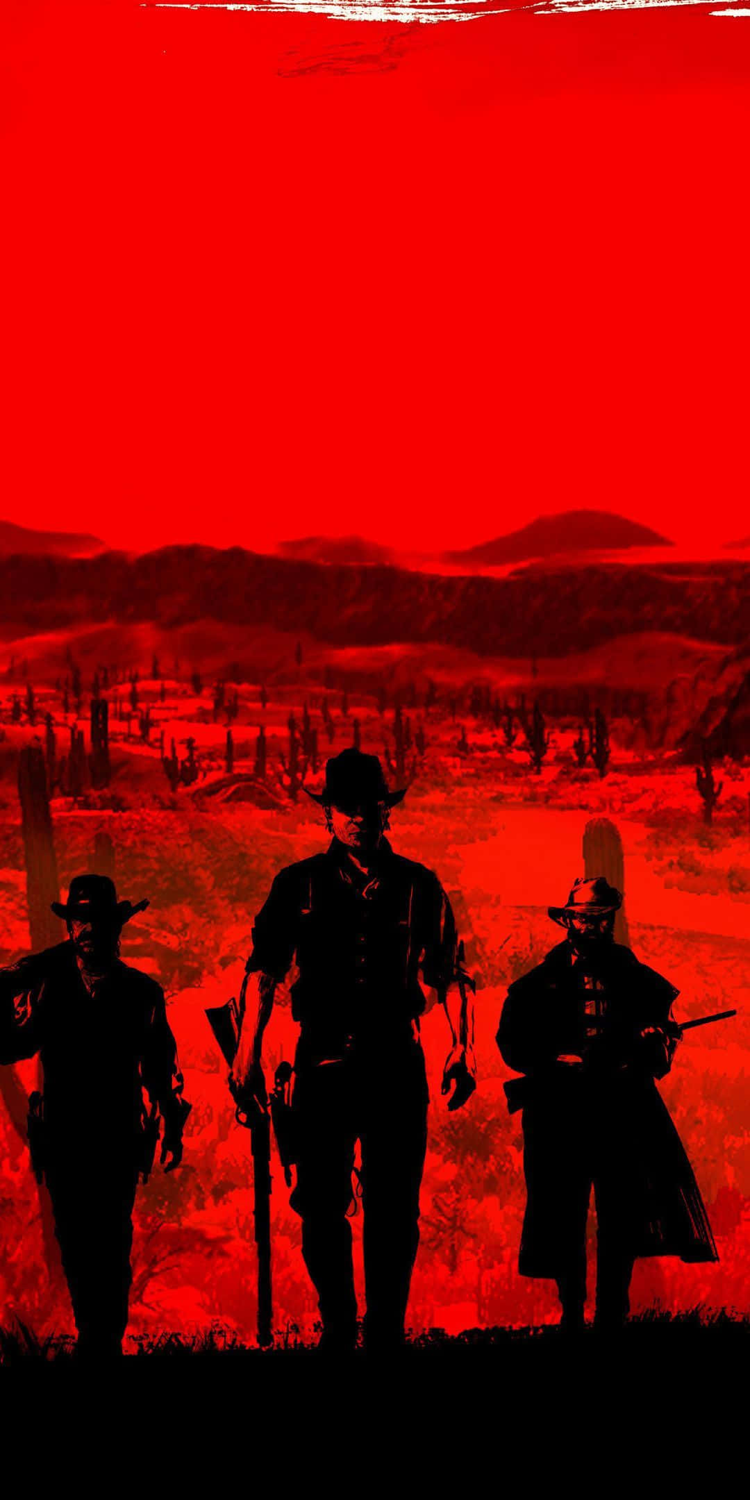 Red Dead Redemption 2 高畫質壁紙 壁紙 — 三個牛仔剪影站在沙漠中，天空呈現強烈的紅色，遠處有平頂山和仙人掌。