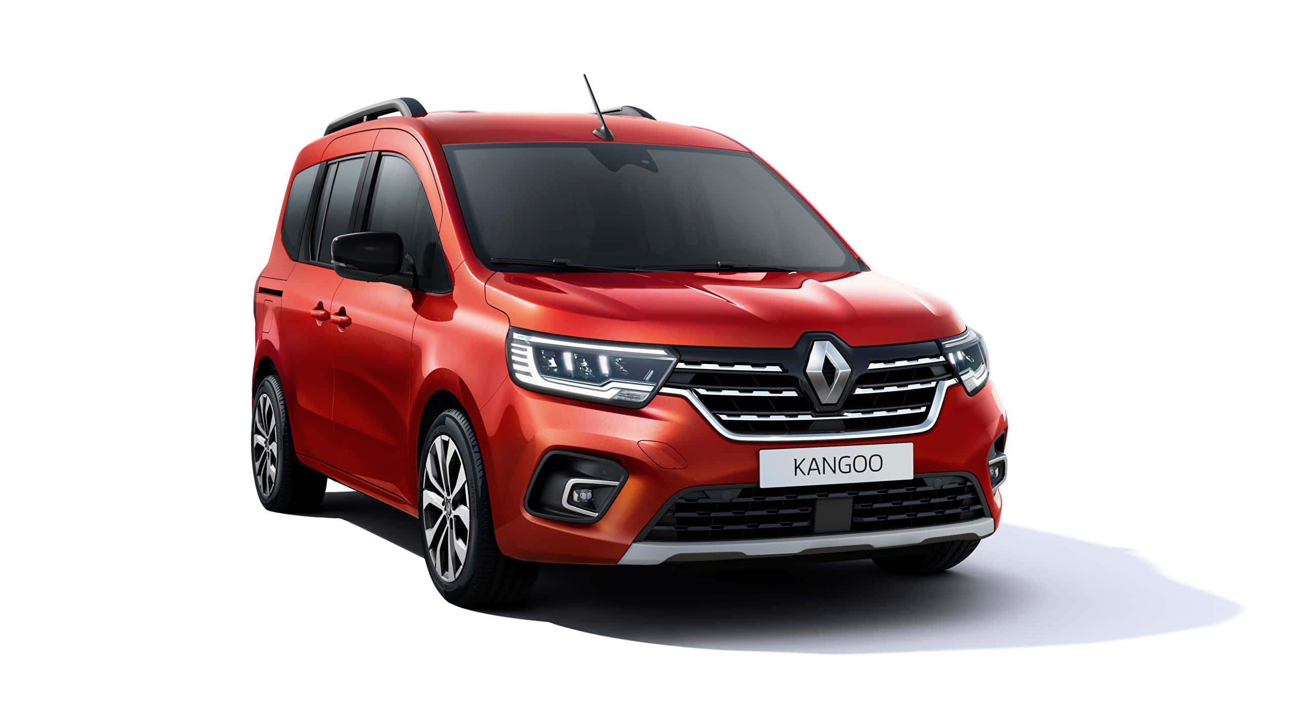 Renault Kangoo 桌布 壁紙 — 一輛鮮紅色的雷諾Kangoo客貨車在工作室燈光下以乾淨的白色背景展示。