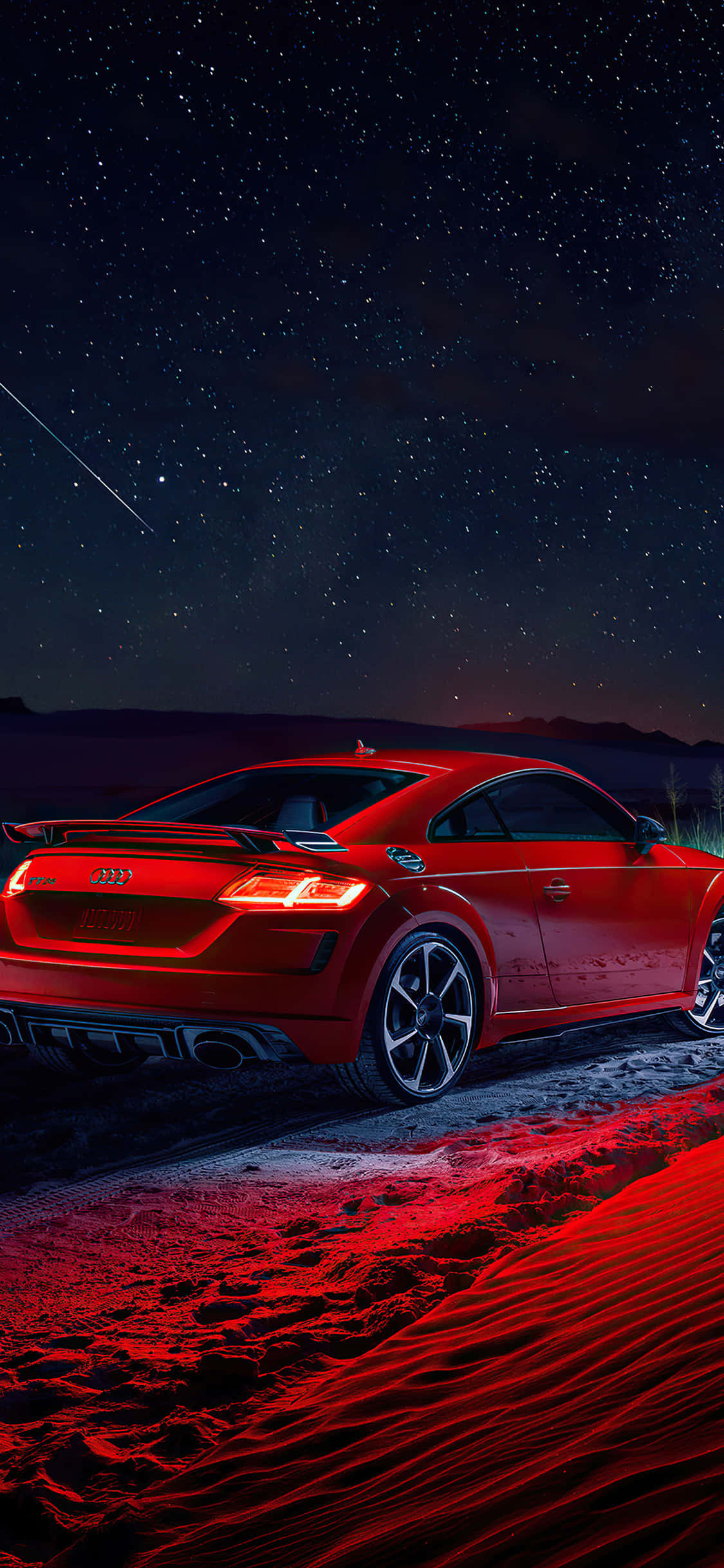 Audi Tt Rs 桌布 壁紙 — 一輛紅色跑車在繁星點點的夜空下閃耀，一顆流星劃過頭頂。