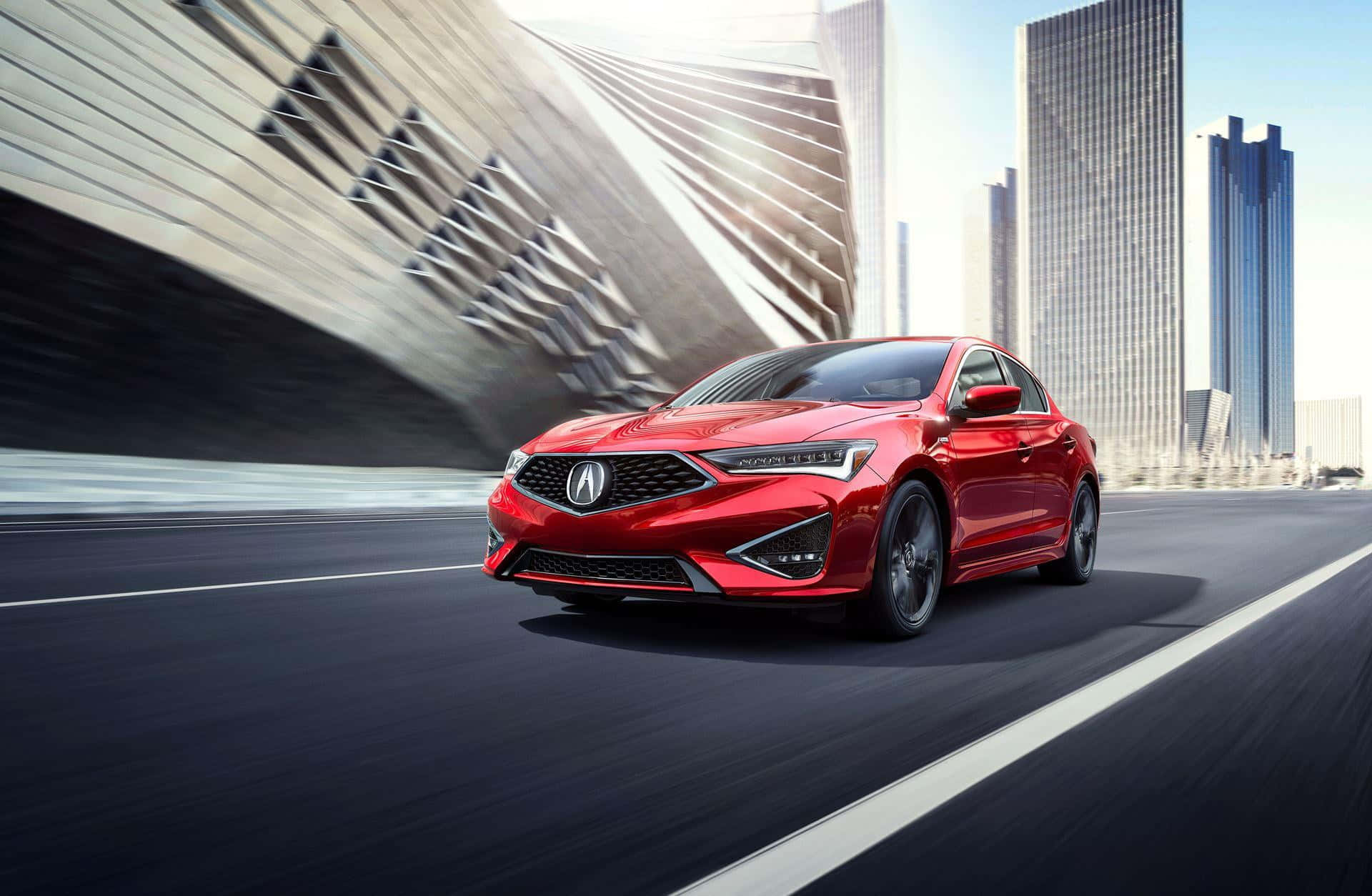 Acura Ilx 桌布 壁紙 — 一輛充滿活力的紅色跑車在現代城市景觀中疾馳，周圍是時尚的摩天大樓和動態模糊效果。