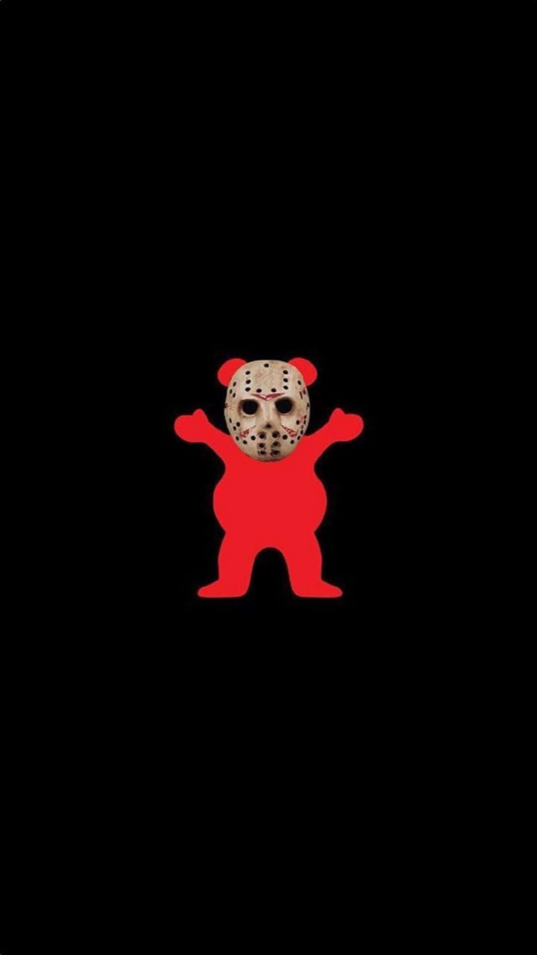  壁紙 — 一個戴著曲棍球面具的紅色泰迪熊公仔，在純黑色背景中央站立。