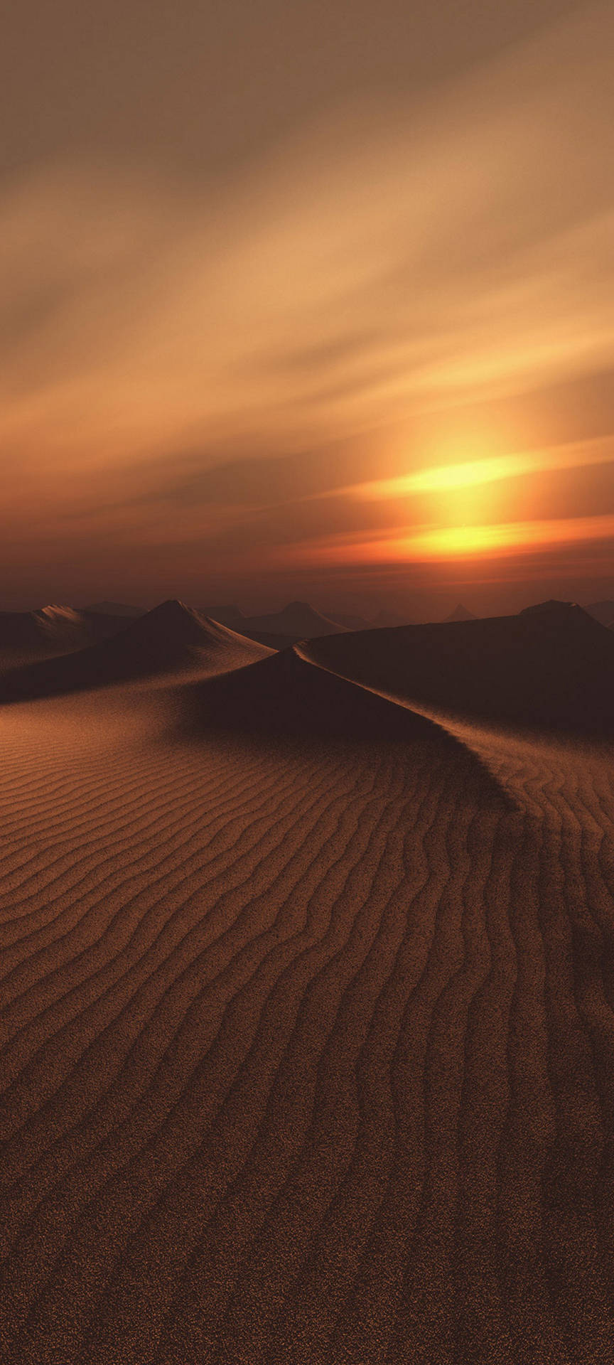 沙漠景觀中起伏沙丘上的夕陽