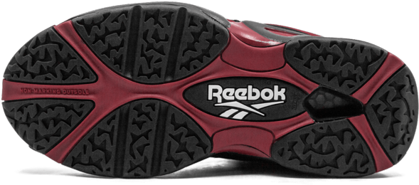 Reebok紅黑鞋底設計 壁紙 — 紅色和黑色 Reebok 運動鞋鞋底的近距離特寫，顯示帶有紋理的鞋底花紋和品牌標誌。