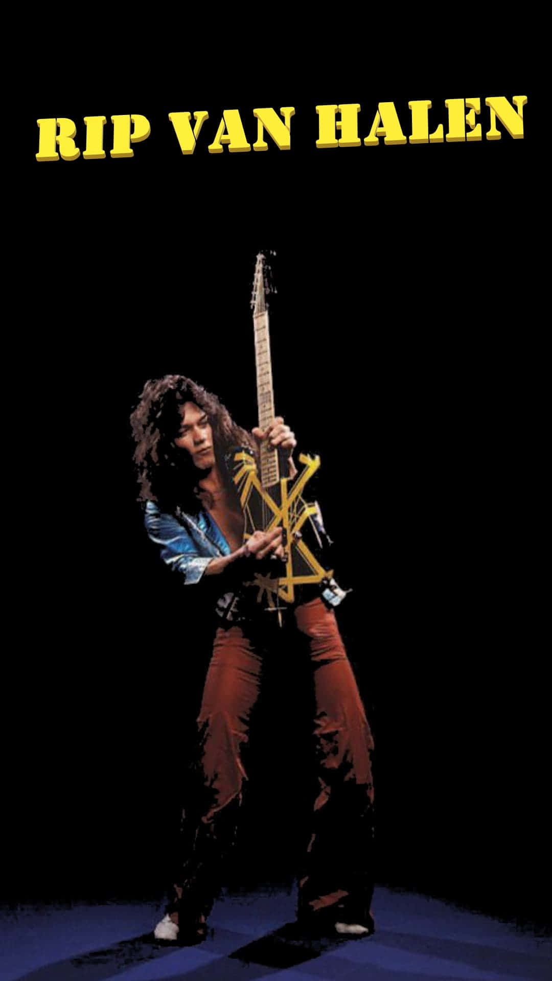 Rip 桌布 壁紙 — Rip Van Halen 站在舞台中央，在黑色背景的戲劇性聚光燈下拿著一把黃色結他。