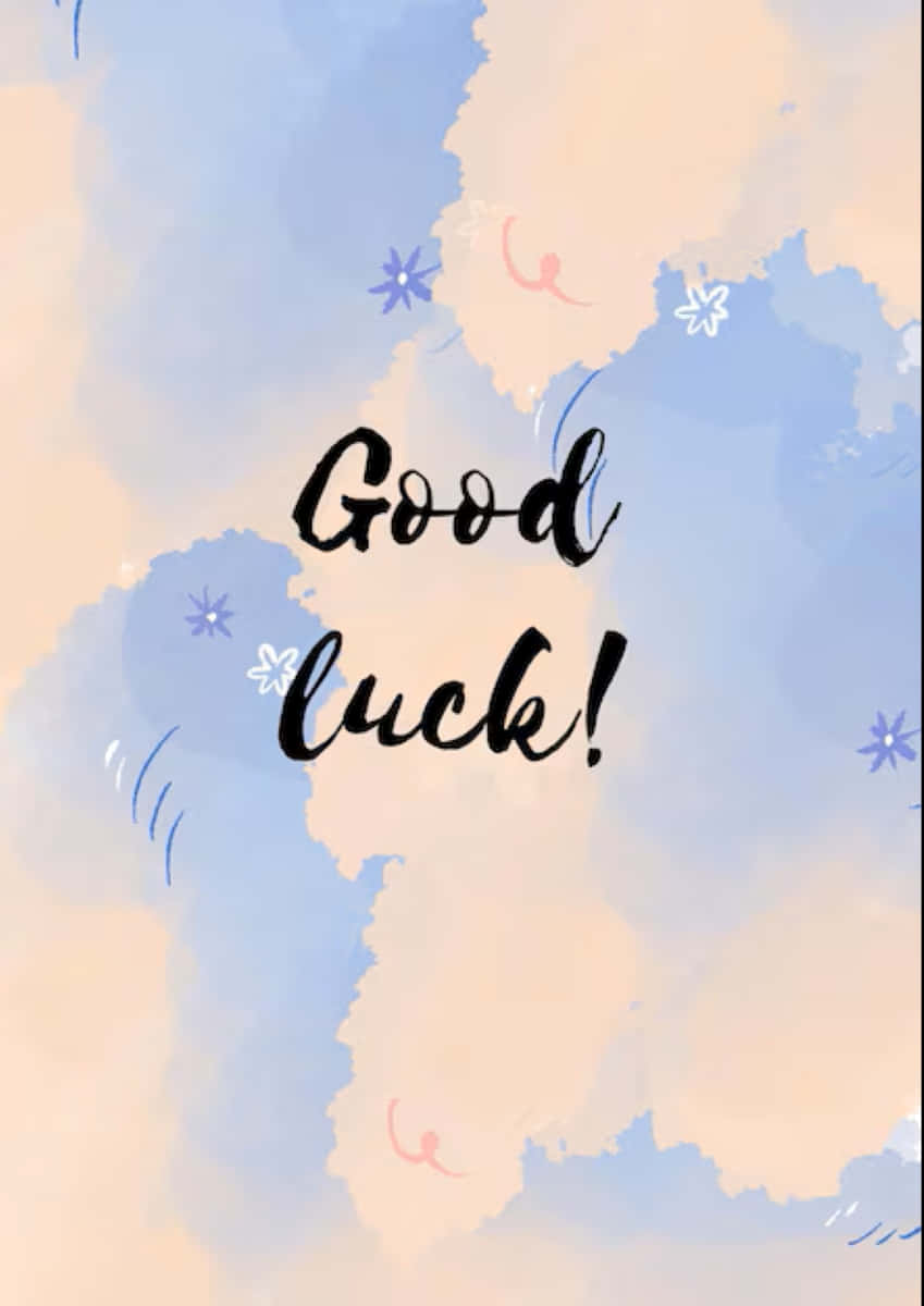  壁紙 — 柔和的水彩雲朵，藍色和蜜桃色，手寫的「Good luck!」被小花環繞。