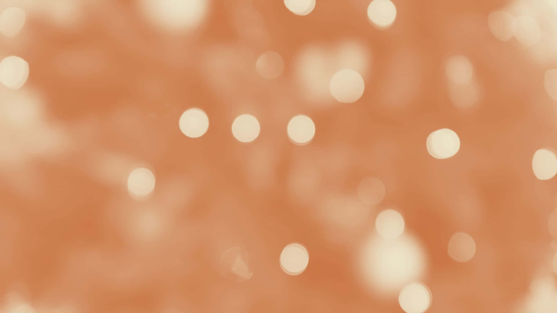  壁紙 — 柔和的蜜桃色背景，散落著奶油般的散景光點，營造出夢幻而溫暖的氛圍。
