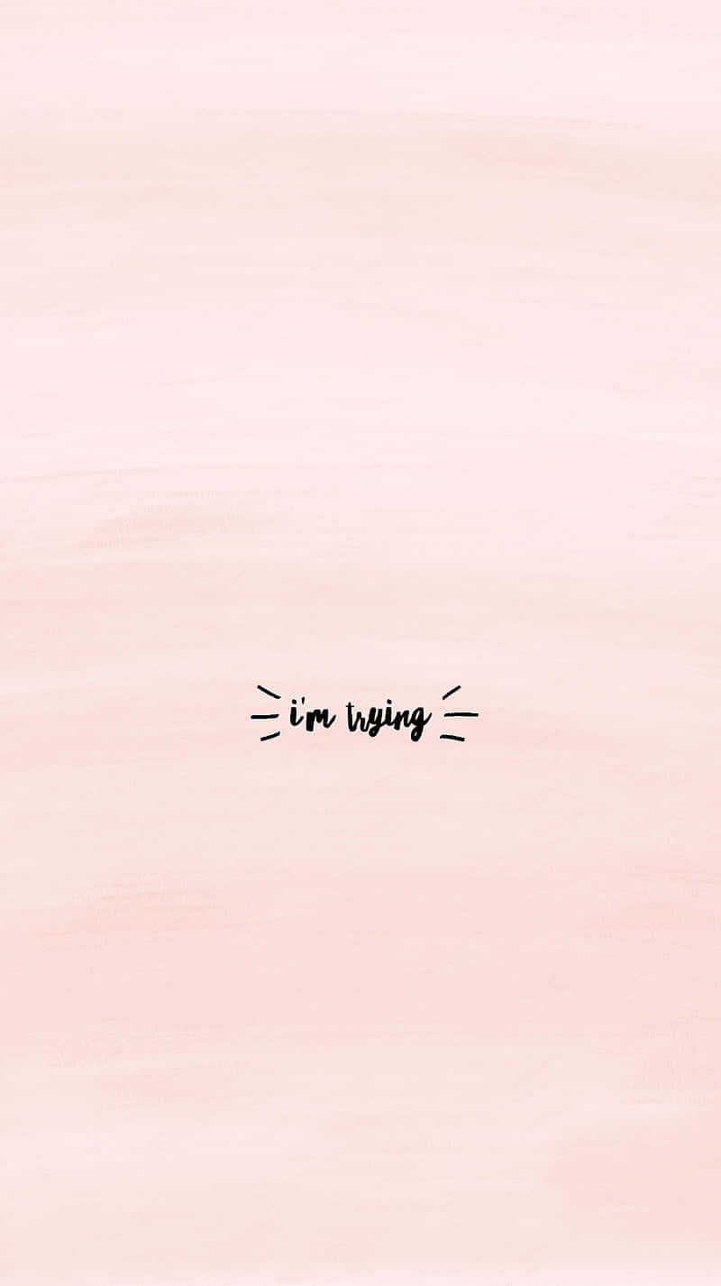  壁紙 — 柔和粉紅色水彩背景，中央有手寫文字「i'm trying」，周圍有短線條。