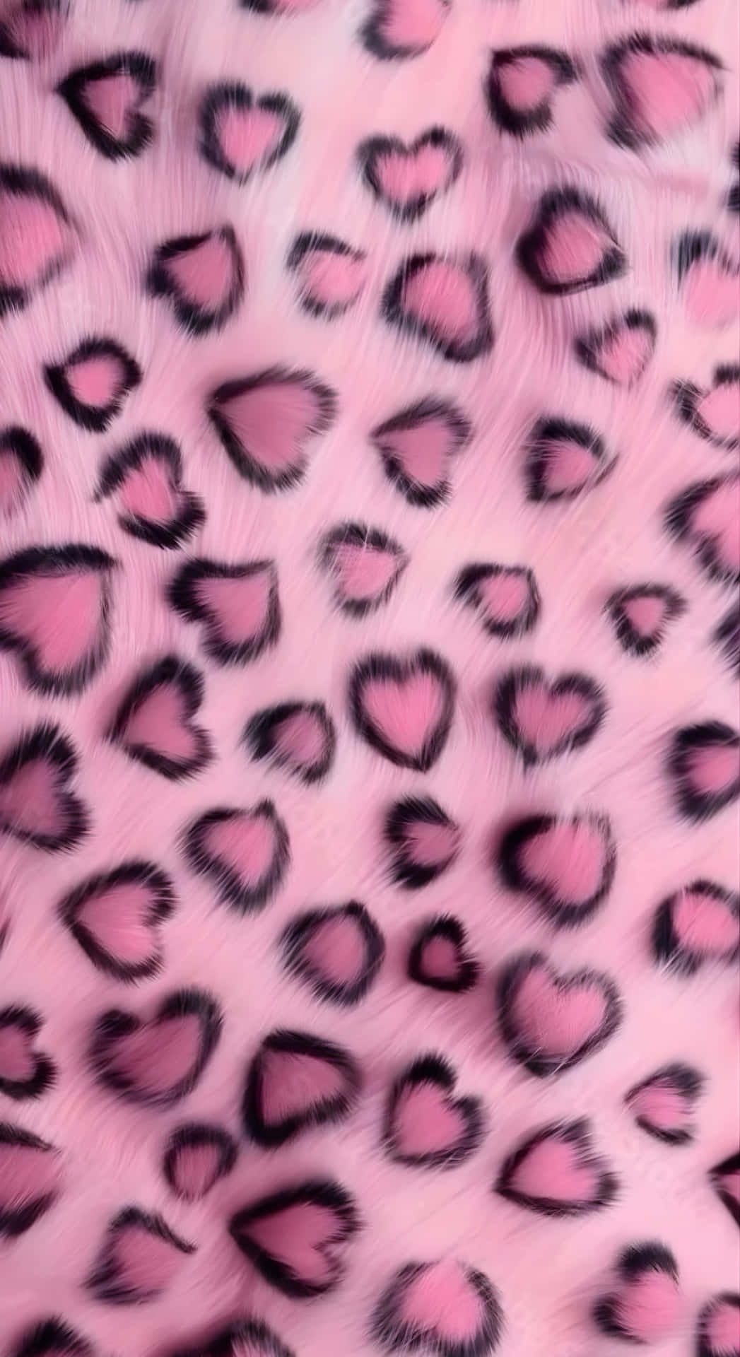  壁紙 — 柔軟的粉紅色毛絨表面，覆蓋著大膽的黑色輪廓心形圖案，類似俏皮的豹紋圖案。