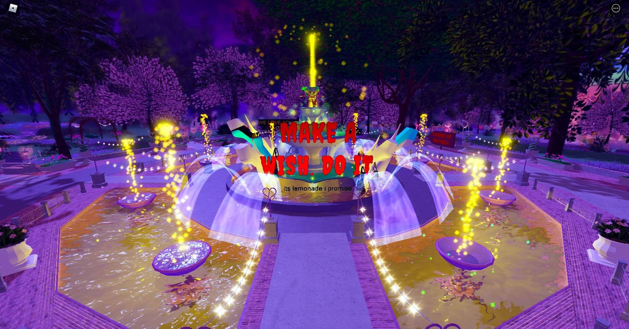 Royale High愚人節噴泉 壁紙 — 一個發光的紫色噴泉，帶有金色火花和一個「MAKE A WISH DO IT」標誌，在充滿活力的夜間公園中。