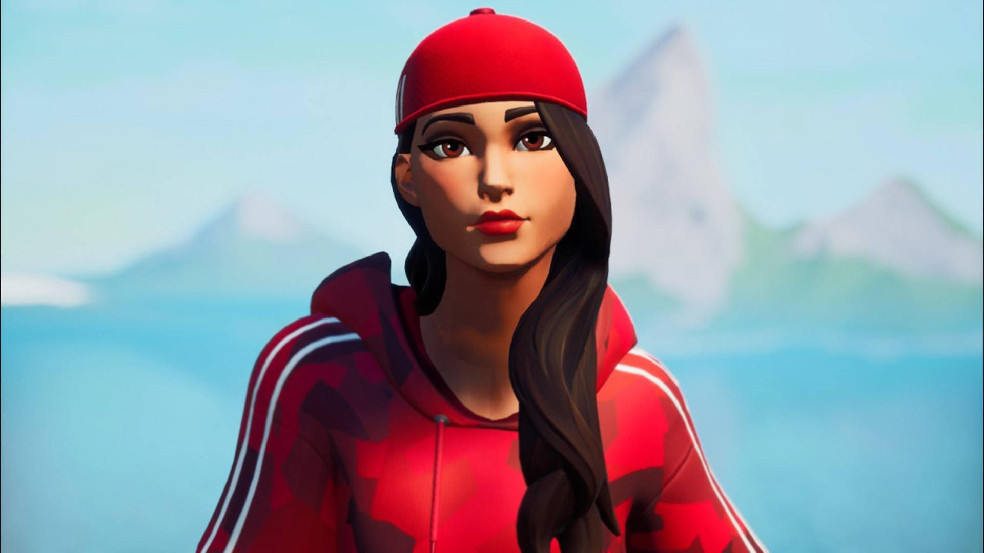 Ruby《Fortnite》遊戲場景 壁紙 — 一個風格化的女性角色，穿著紅色連帽衫和帽子，站在清晰天空下柔焦的山景背景前。
