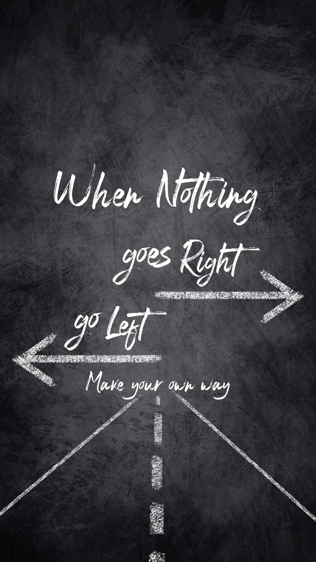  壁紙 — 深色黑板上嘅白色粉筆字寫住「When Nothing goes Right go Left Make your own way」，仲有箭嘴。
