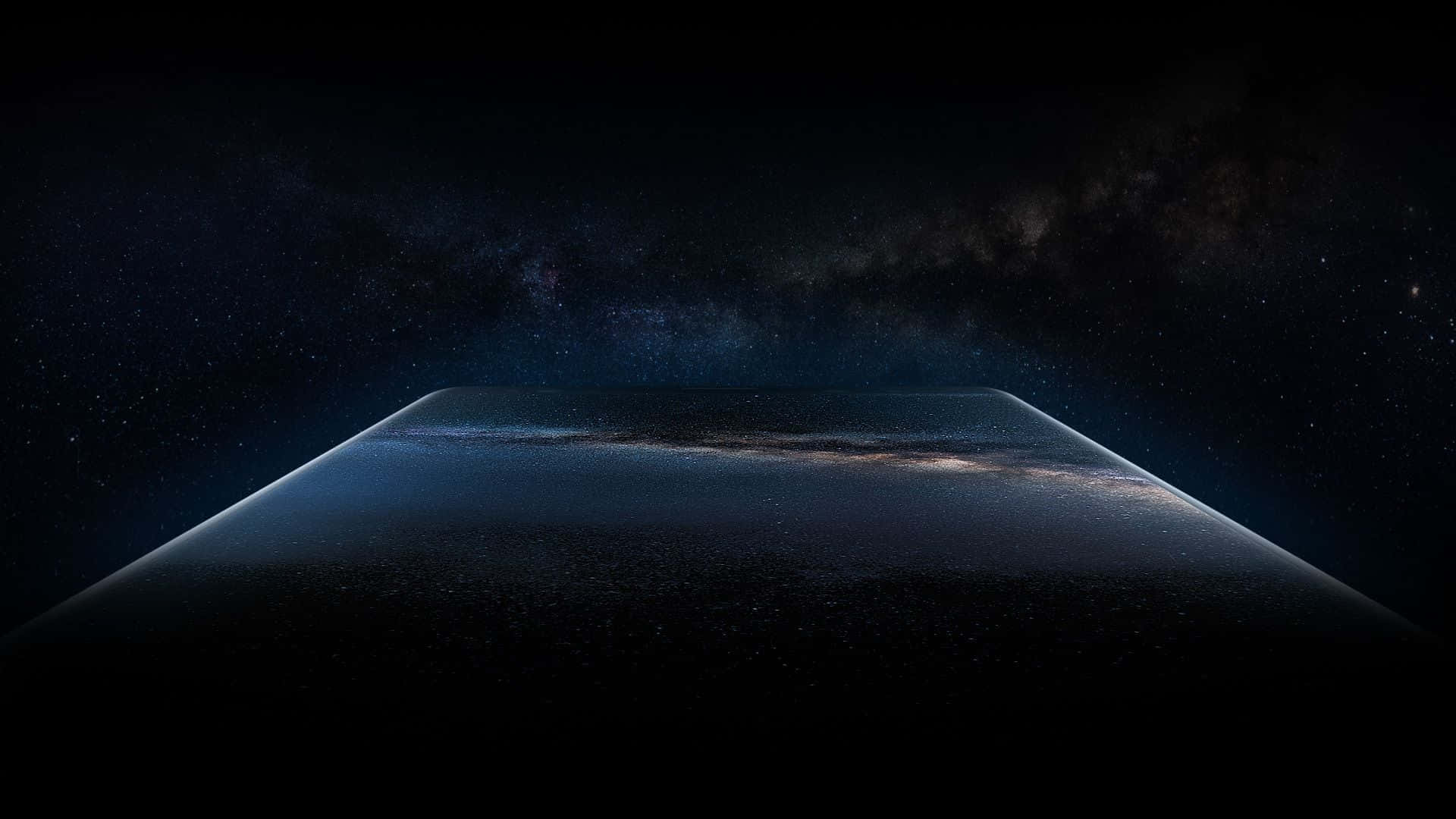 以 Samsung Dex 提升您的工作效率 壁紙 — 宇宙景觀展現銀河系在深邃黑色天空下，彎曲在黑暗、佈滿星星的地平線上。