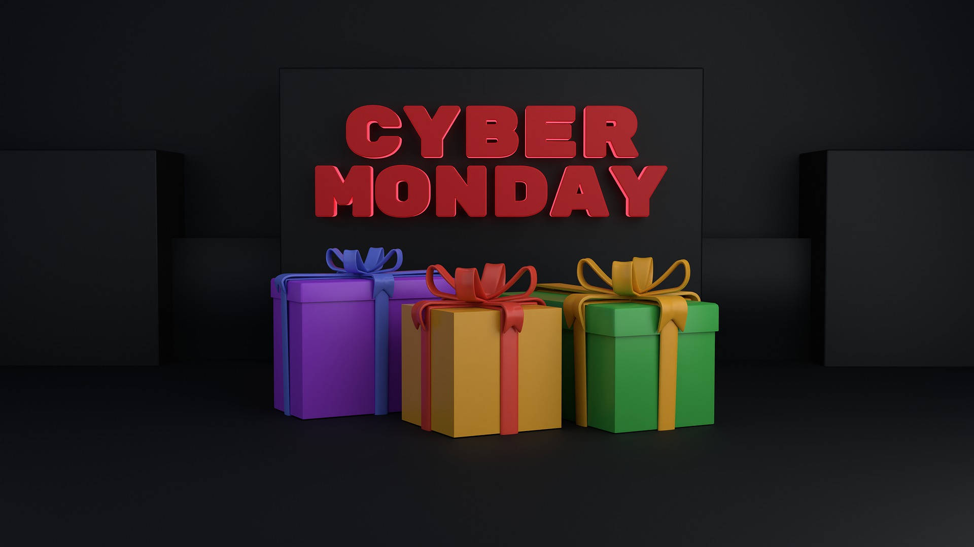三個帶有蝴蝶結的禮物盒，位於「CYBER MONDAY」標誌下方。