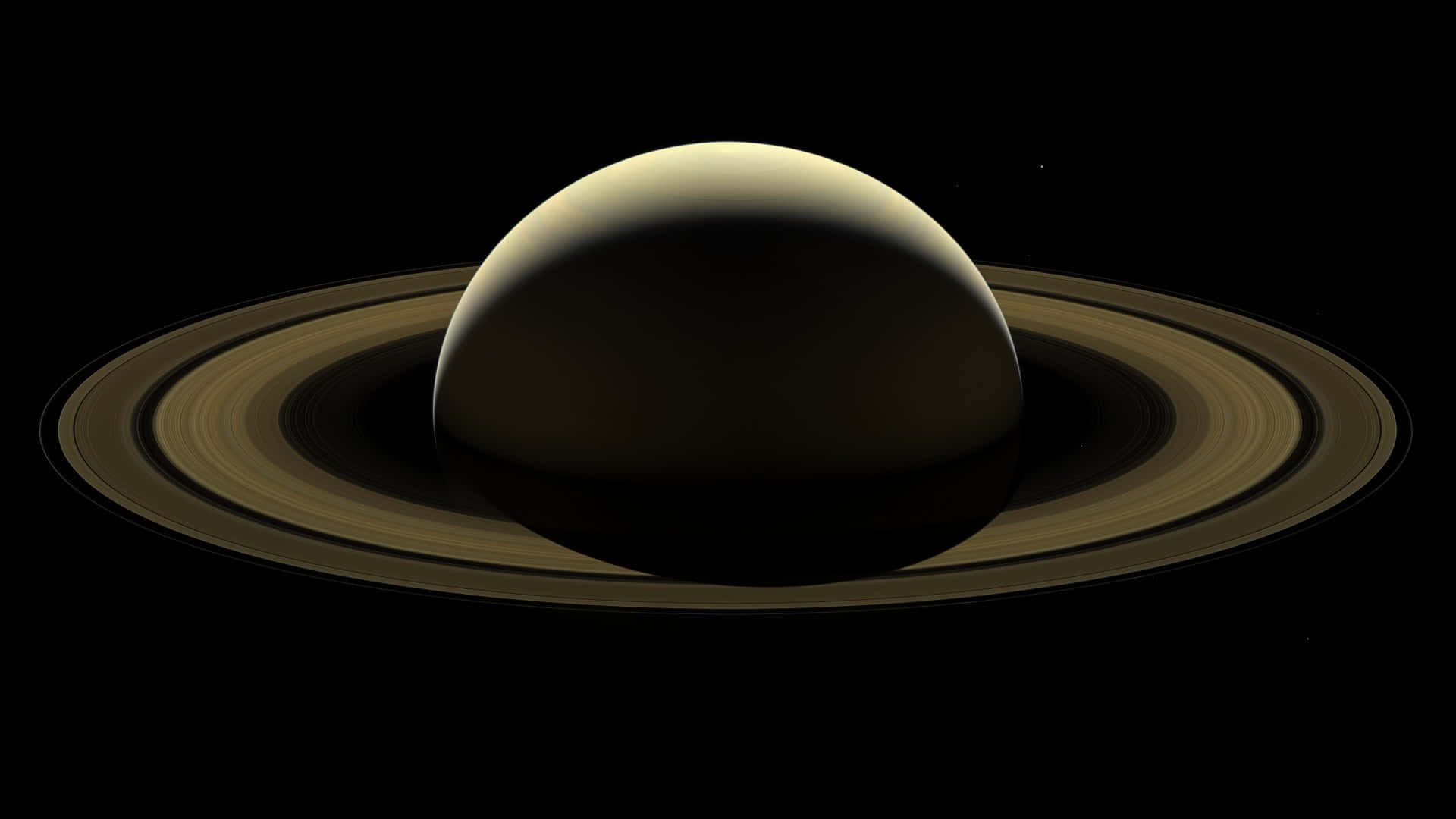 土星及其光環在太空黑暗中發光。