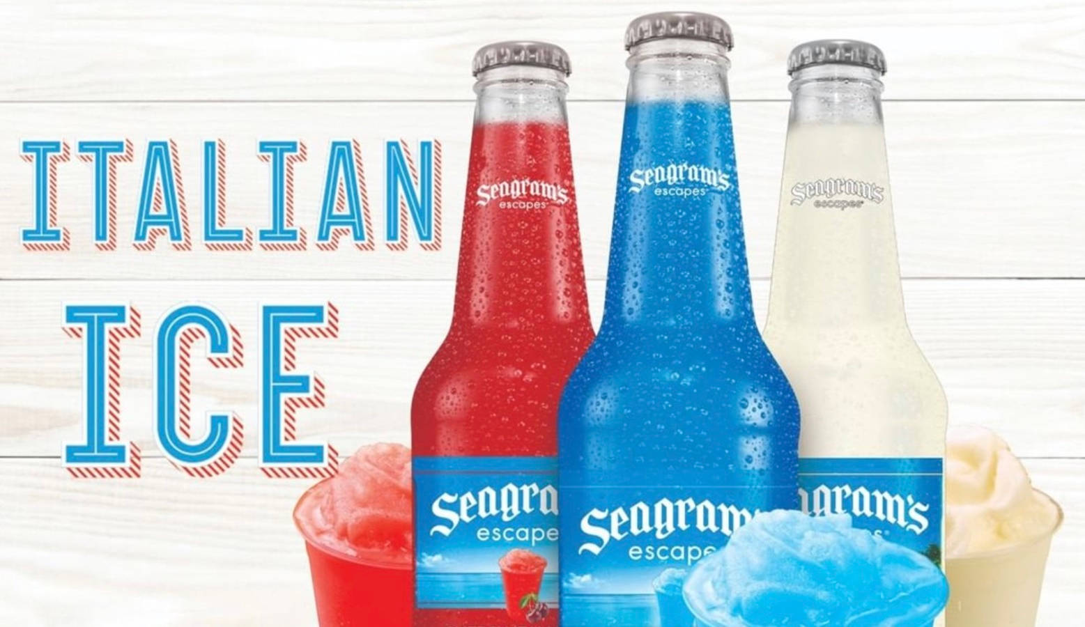 三支色彩繽紛的Seagram's Escape飲品樽，配上相配的冰凍沙冰，置於白色木背景上。