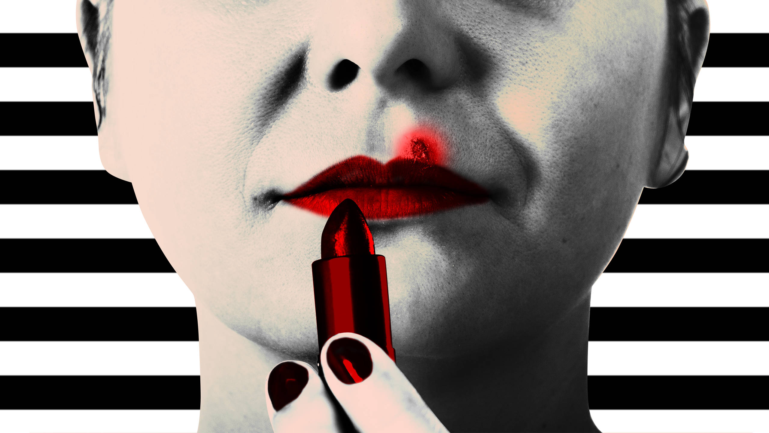 Sephora 經典美妝風 壁紙 — 一個人在黑白條紋背景上塗抹大膽紅色唇膏的特寫。