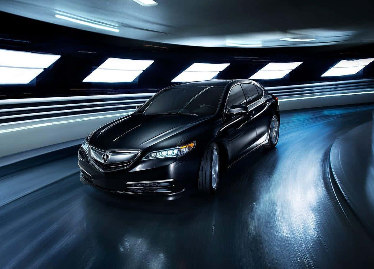Acura Tlx 桌布 壁紙 — 一輛時尚的黑色轎車在未來感隧道中疾馳，伴隨著發光的藍色燈光和動態模糊效果。